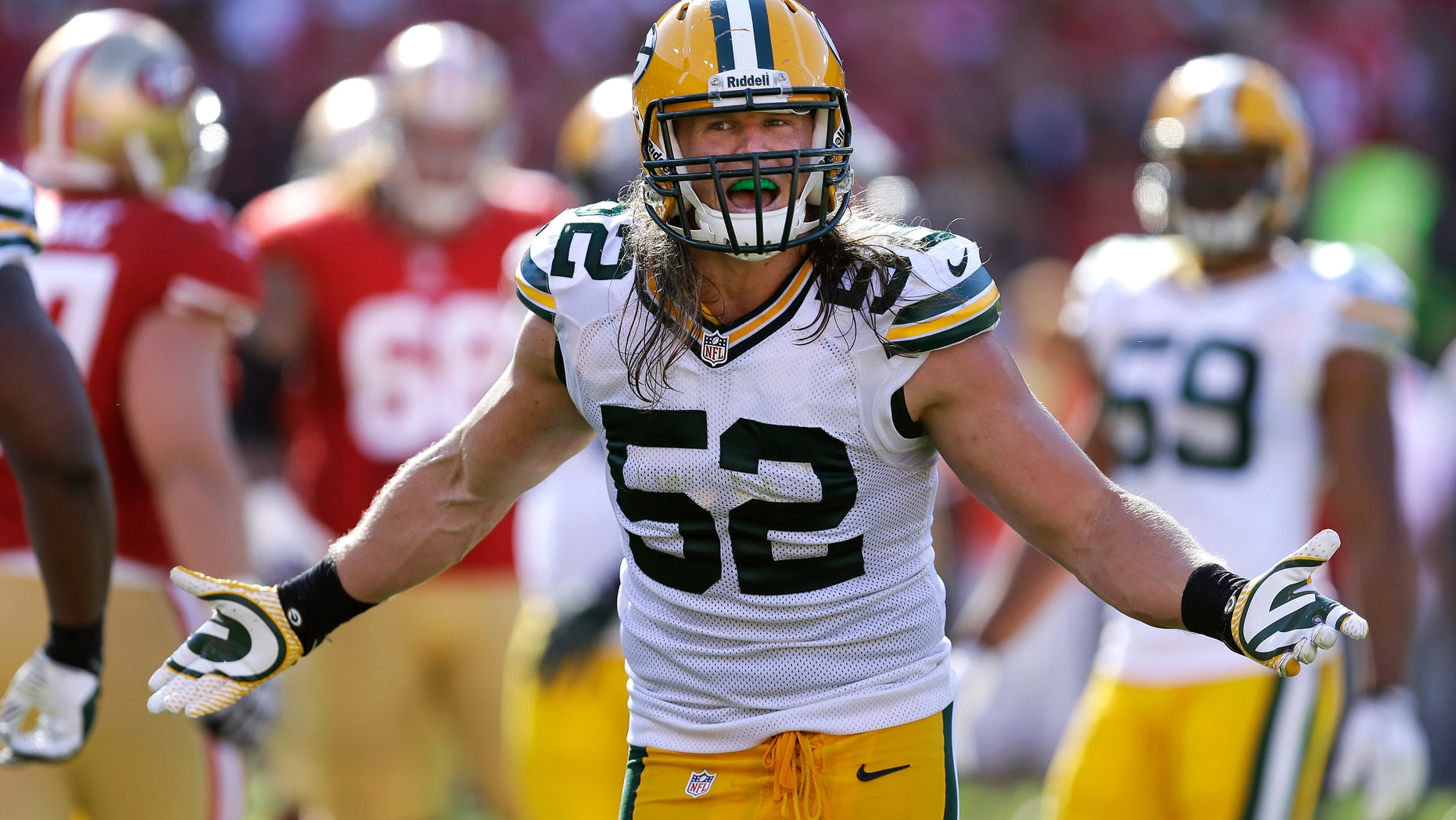 FILE - In this Sept. 8, 2013 file photo, Green Bay Packers outside linebacker Clay Matthews (52) gestures during the fourth quarter of an NFL football game against the San Francisco 49ers in San Francisco. Some good injury news for the Packers for a change: pass-rushing star Matthews might be on his way back to the field, with a club wrapped around his right hand to protect an injured thumb. (AP Photo/Ben Margot, File)