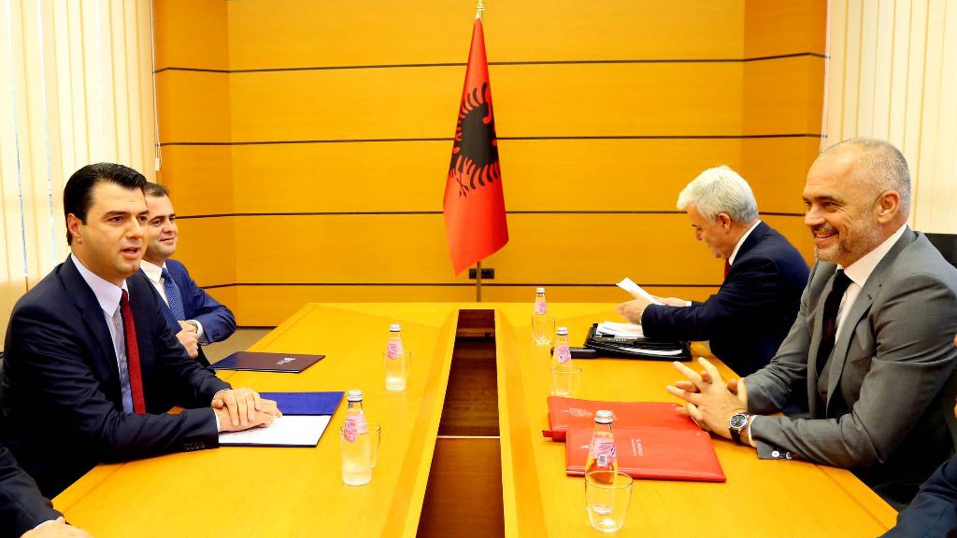 Delegations headed by Prime Minister Edi Rama, right, of the governing left-wing Socialist Party and Lulzim Basha, left, of the center-right Democratic Party meet at the Palace of Congresses to discuss on a judicial reform considered as a decisive step for the country's further moves toward membership of the European Union. (AP Photo/Hektor Pustina)
