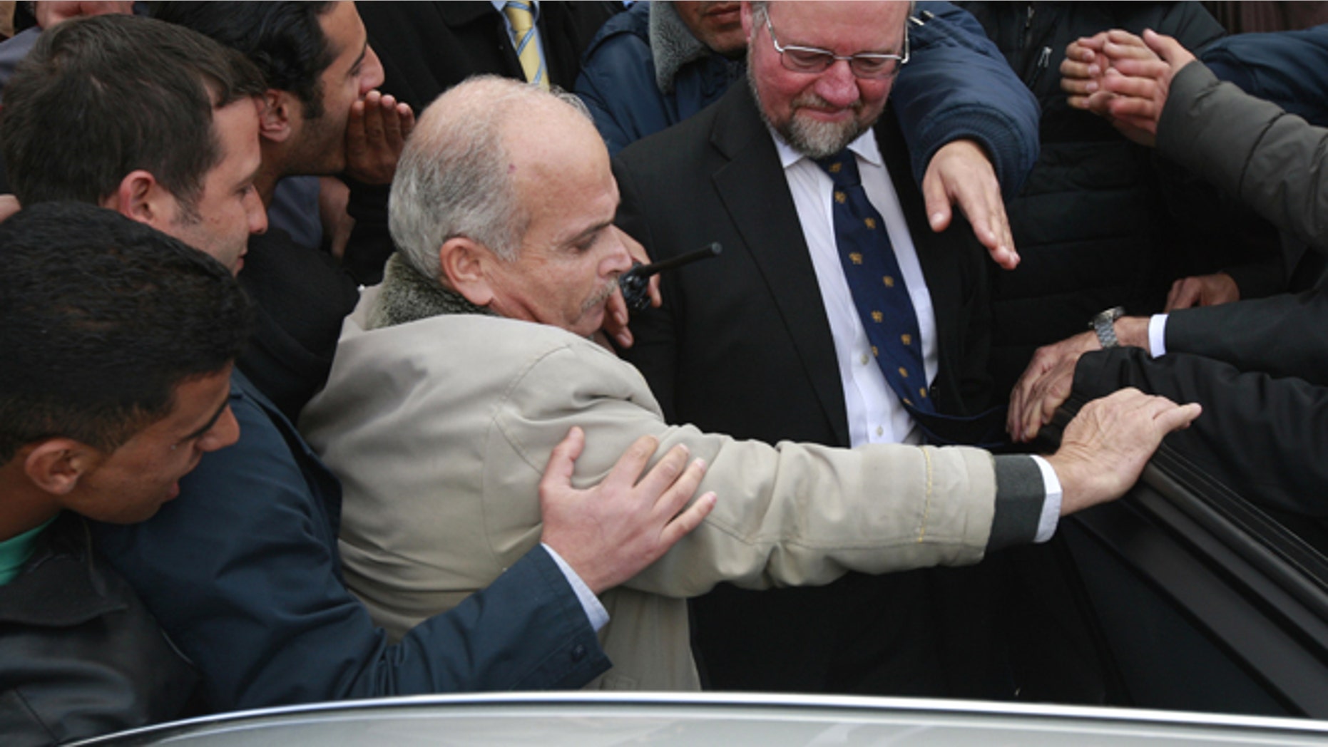 March 5, 2013: Palestinians students block the British consul general Sir Vincent Fean, center wearing glasses, from giving a speech at the Birzeit University, near Ramallah.