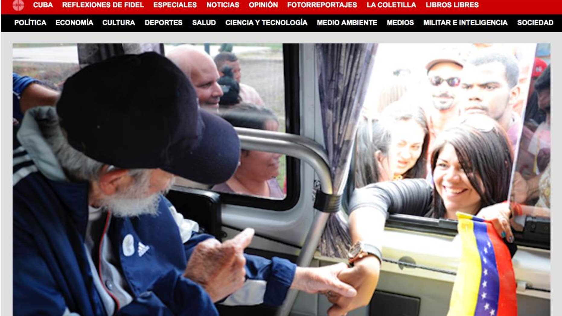 A screenshot of Cuba's website Cubadebate shows Fidel Castro on their opening page in Havana, Cuba, Saturday April 4, 2015. Former longtime Cuban president Fidel Castro has appeared in public for the first time in more than a year. The official website Cubadebate says Castro showed up to greet a group of Venezuelans visiting the capital of Havana last Monday. Cubadebate published four images on Frday April 3, 2015 that show Castro sitting inside a vehicle, each with a different person stretching an arm through the window to shake his hand. Castro’s face is largely obscured by a dark-colored baseball cap.(AP Photo)