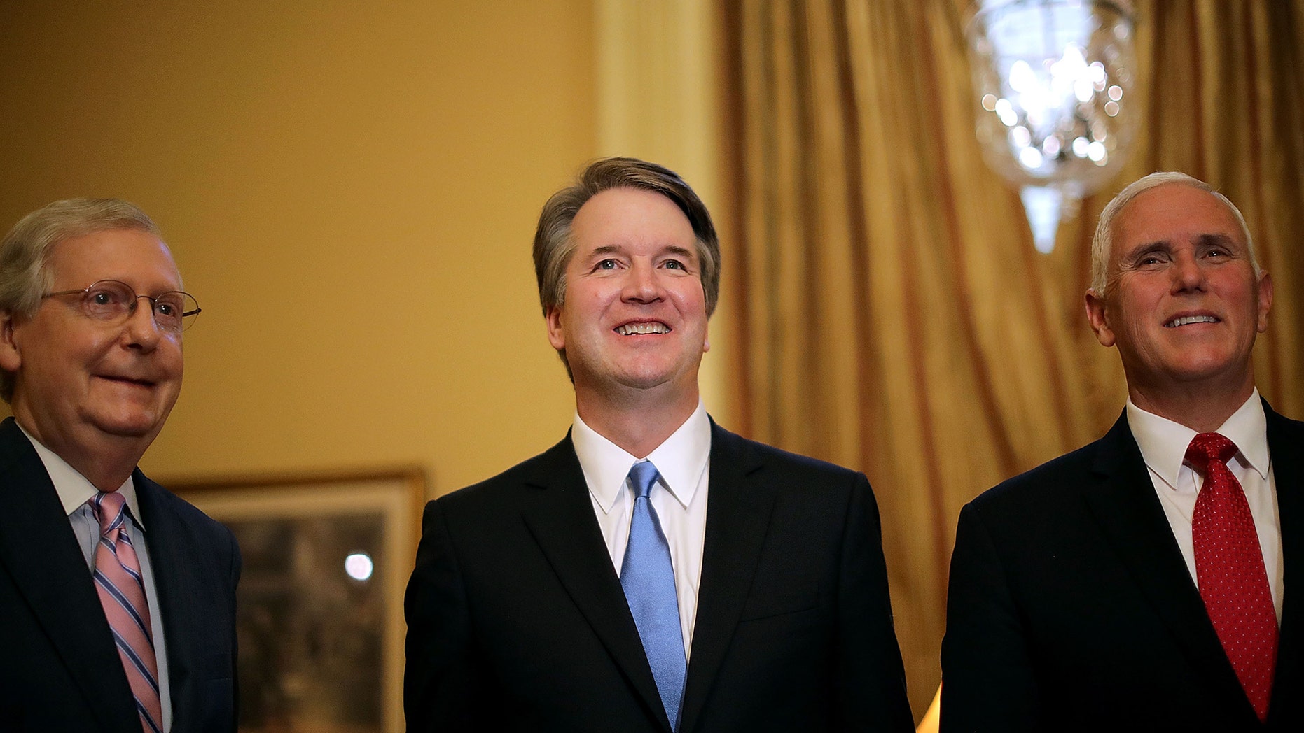 WASHINGTON, DC - JULY 10: (L-R) Senate Majority Leader Mitch McConnell (R-KY), Judge Brett Kavanaugh and Vice President Mike Pence pose for photographs before a meeting in McConnell's office in the U.S. Capitol July 10, 2018 in Washington, DC. U.S. President Donald Trump nominated Kavanaugh to succeed retiring Supreme Court Associate Justice Anthony Kennedy. (Photo by Chip Somodevilla/Getty Images)