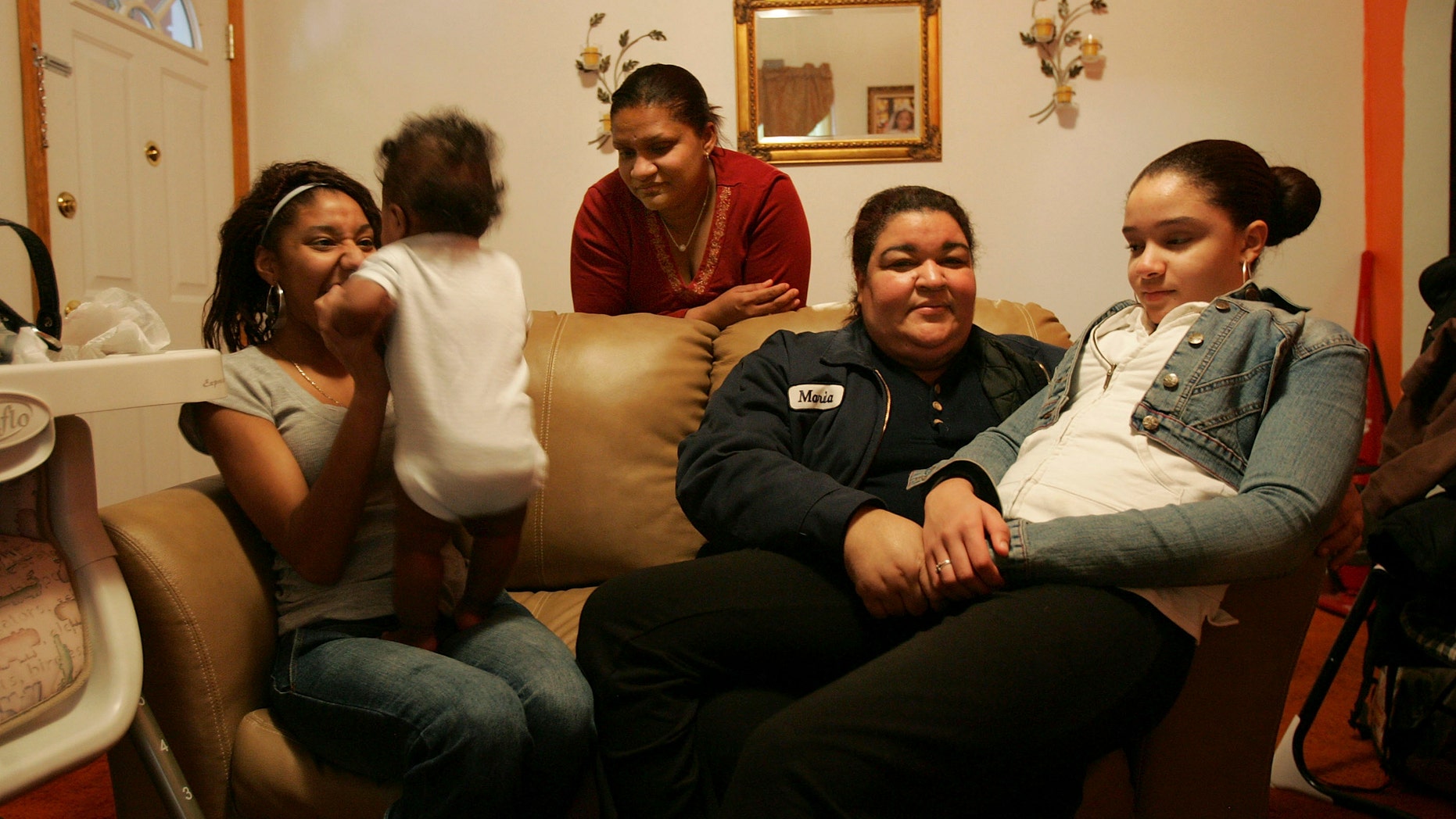 HAZLETON, PA - MARCH 14: Members of the Castillo family sit in their living room March 14, 2007 in Hazleton, Pennsylvania. (Photo by Spencer Platt/Getty Images)