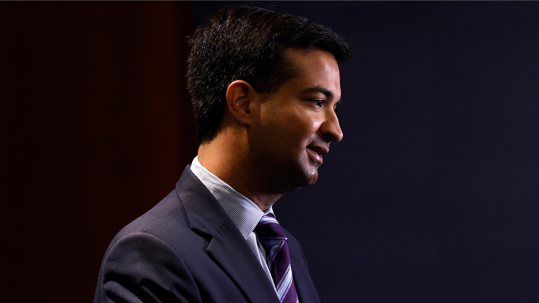 FILE - In this Nov. 13, 2014 fil photo, Rep.-elect Carlos Curbelo, R-Fla., does a television interview on Capitol Hill in Washington. (AP Photo/Susan Walsh, File)