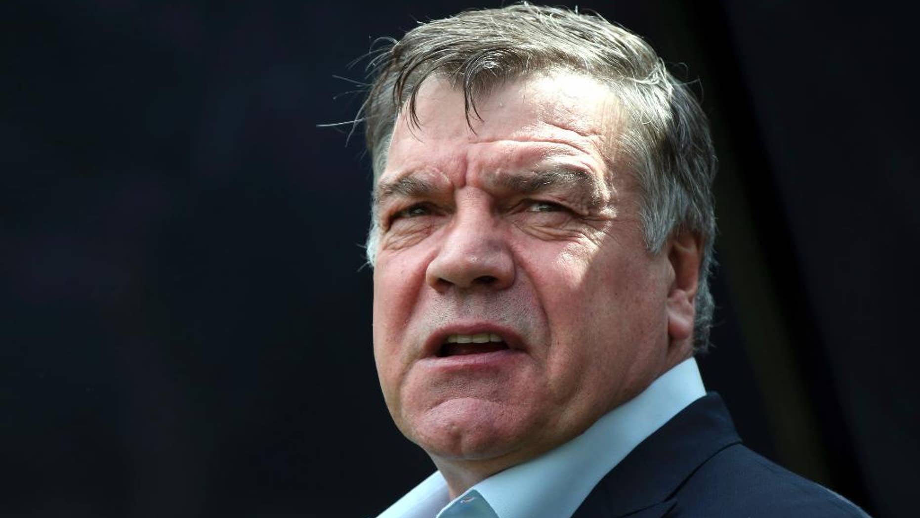 FILE - In this Sunday, May 24, 2015 file photo, Sam Allardyce waits at the start of the English Premier League soccer match between Newcastle United and West Ham United's at St James' Park, Newcastle, England. Former England manager Sam Allardyce has arrived at Crystal Palace’s training ground and says he will “complete talks” with the club’s chairman regarding its managerial vacancy. Allardyce is the favorite to take over at Palace following the firing of Alan Pardew on Thursday Dec. 22, 2016. (AP Photo/Scott Heppell, file)