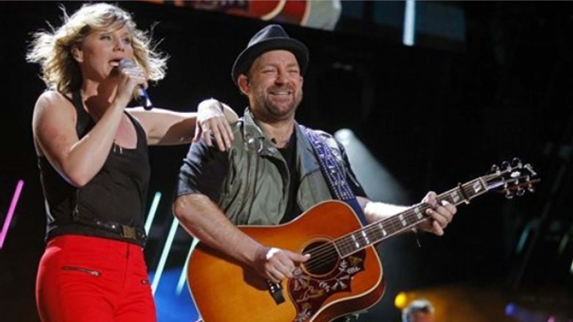 Jennifer Nettles, left, and Christian Bush of Sugarland perform during the CMA Fan Festival Friday, June 10, 2011 in Nashville, Tenn. (AP Photo/Wade Payne)