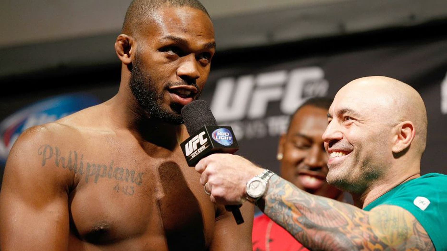 BALTIMORE, MD - APRIL 25: (L-R) Jon "Bones" Jones is interviewed by Joe Rogan during the UFC 172 weigh-in at the Baltimore Arena on April 25, 2014 in Baltimore, Maryland. (Photo by Josh Hedges/Zuffa LLC/Zuffa LLC via Getty Images)