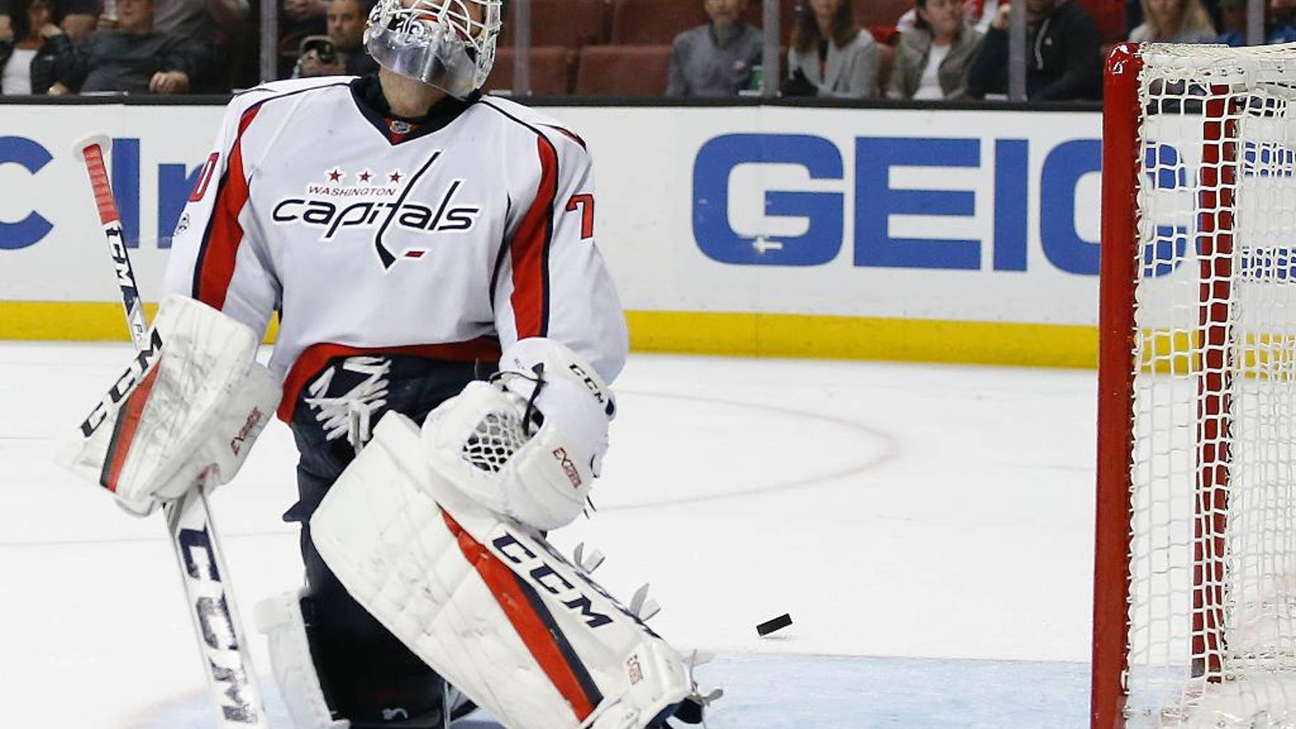 FILE- In this Sunday, March 12, 2017, file photo Washington Capitals goalie Braden Holtby laments as the puck pounces out of the net, after a goal by Anaheim Ducks center Rickard Rakell during the second period of an NHL hockey game in Anaheim, Calif. The Capitals have lost four straight games. The overall NHL leaders are hoping this late-season adversity finally gives them the toughness necessary for playoff success. (AP Photo/Alex Gallardo, File)