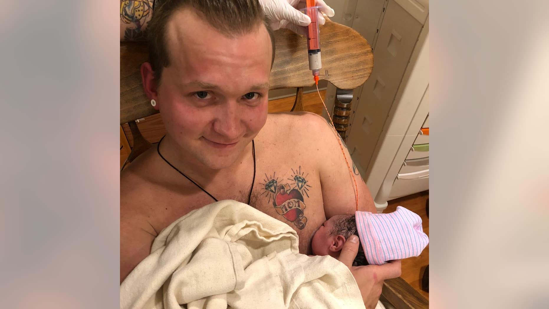 Maxamillian Neubauer "breastfed" his newborn daughter with the help of a nurse and a "suction cup fake nipple."