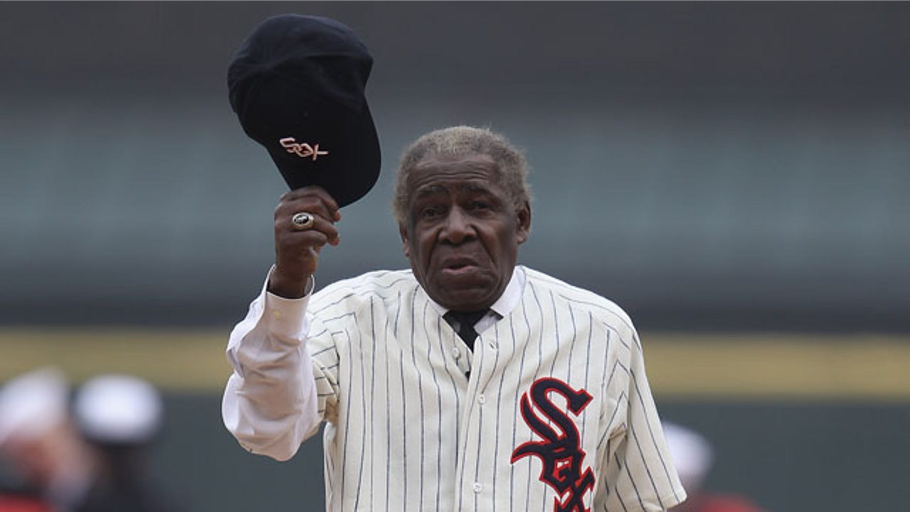 CHICAGO, IL - APRIL 07: Six time All-Star Minnie Minoso waves his hat to the crowd as he's introducted to throw out a ceremonial first pitch before the home opener between the Chicago White Sox and the Tampa Bay Rays at U.S. Cellular Field on April 7, 2011 in Chicago, Illinois. (Photo by Jonathan Daniel/Getty Images)