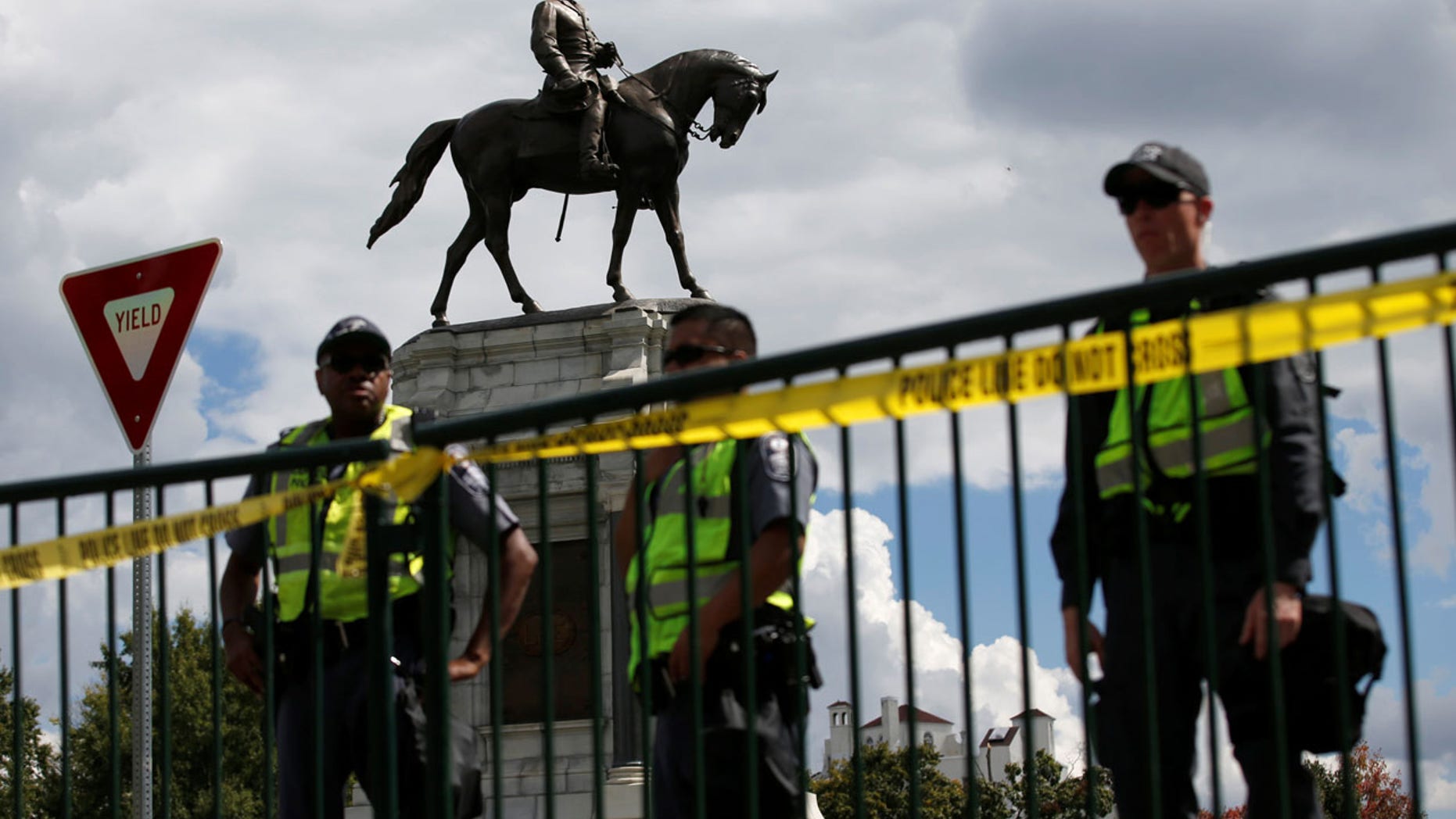 FILE 2017: Police stand in front of the statue of Confederate General Robert E. Lee in Richmond, Virginia