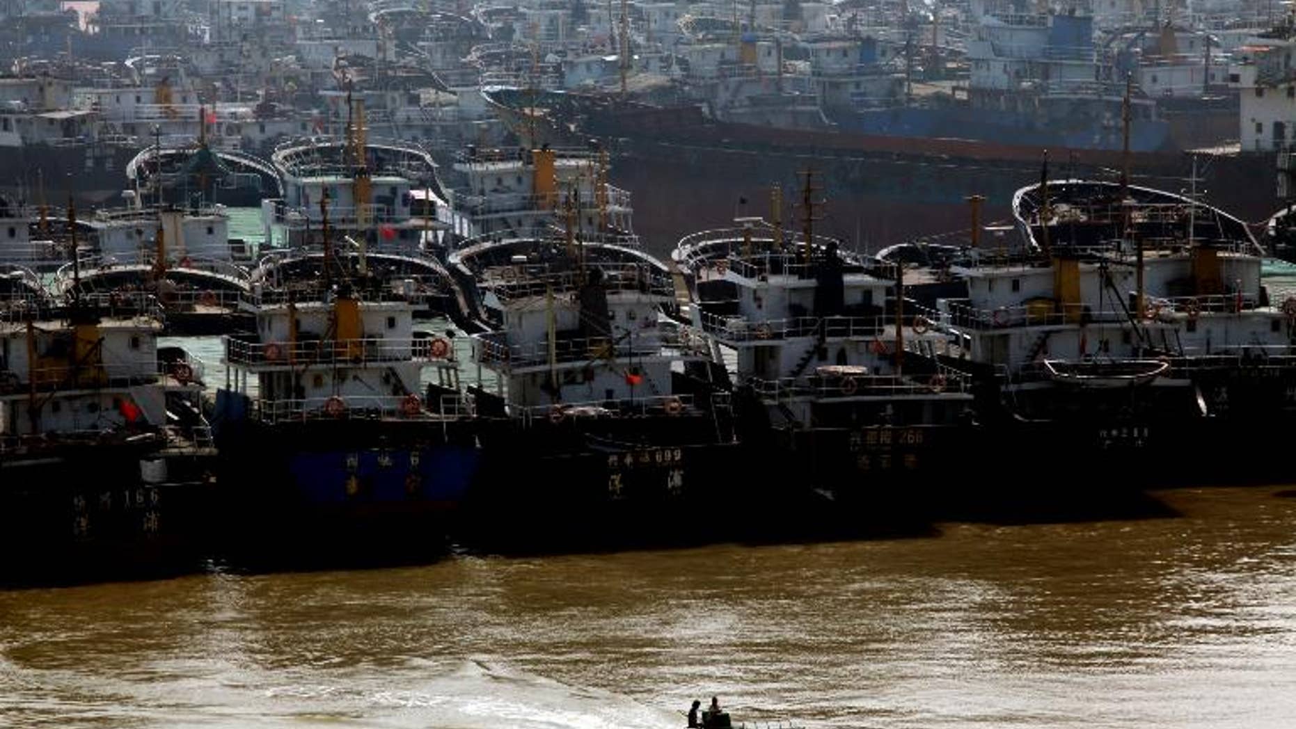 More than 70 people were missing after three fishing boats sank in a powerful typhoon in the South China Sea, Chinese state media says