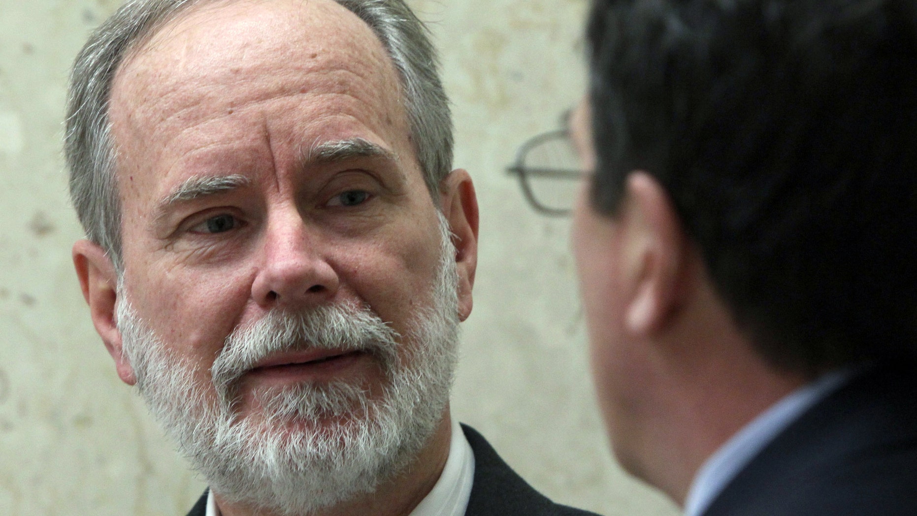 March 7, 2012: David Coppedge, left, is shown outside Los Angeles Superior Court with his attorney, William Becker.