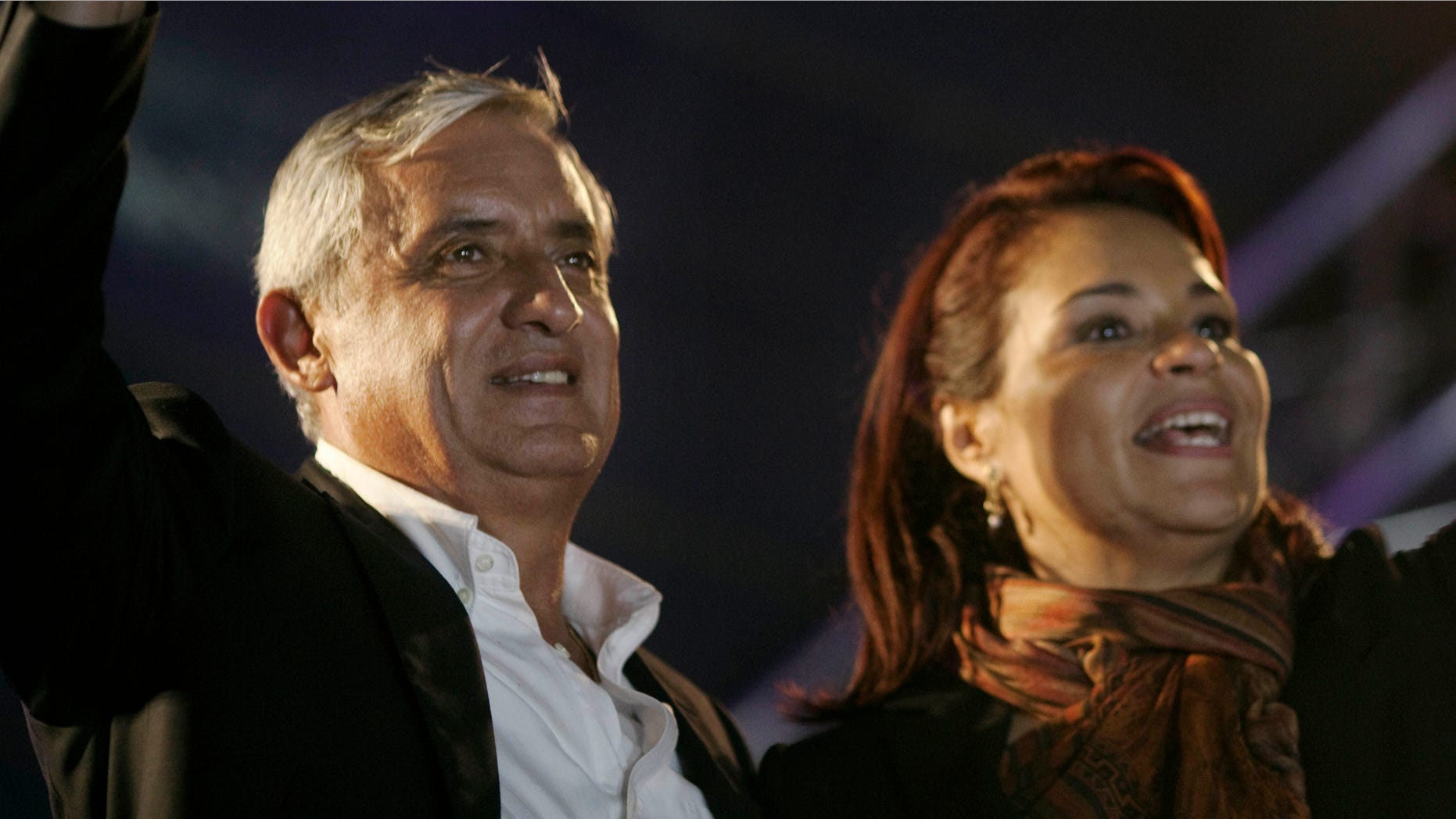 Patriotic Party presidential candidate, Otto Perez Molina, and vice president candidate Roxana Baldetti celebrate their victory in Guatemala City, Monday, Nov. 7, 2011. Perez Molina won 55 percent of the vote, topping Manuel Baldizon, of the Democratic Freedom Revival party, who had 45 percent with 96 percent of the vote counted Sunday night, according to Guatemala's Supreme Electoral Tribunal. (AP Photo/Rodrigo Abd)