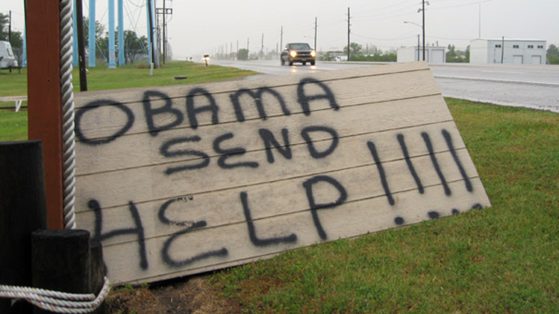 May 2: A sign on the side of a road in Boothville, La. calls for help to combat the massive Gulf oil spill.
