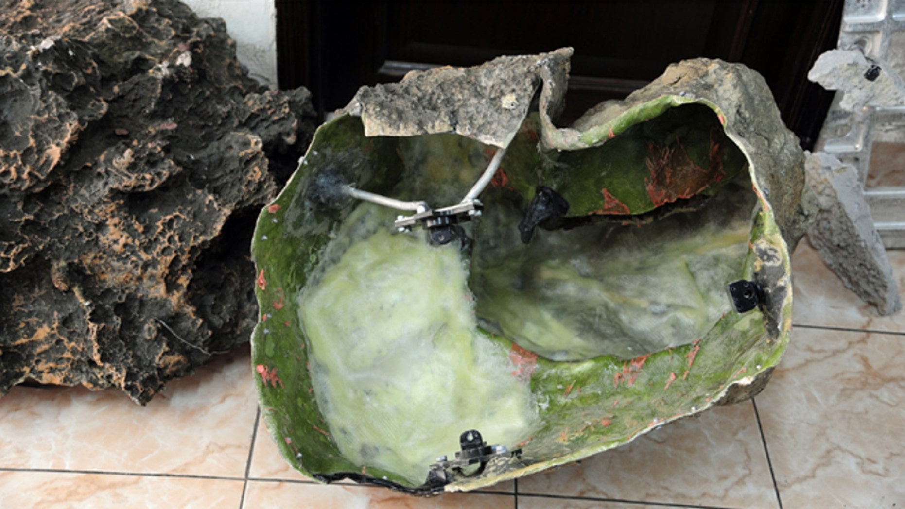 In this photo released by the Syrian official news agency SANA, shows devices that appear to be like rocks that were found in countrys coastal region, northwest of Damascus, Syria, Thursday, March. 7, 2013. Syria's state-run media said they were placed by Israel to spy on Syria.