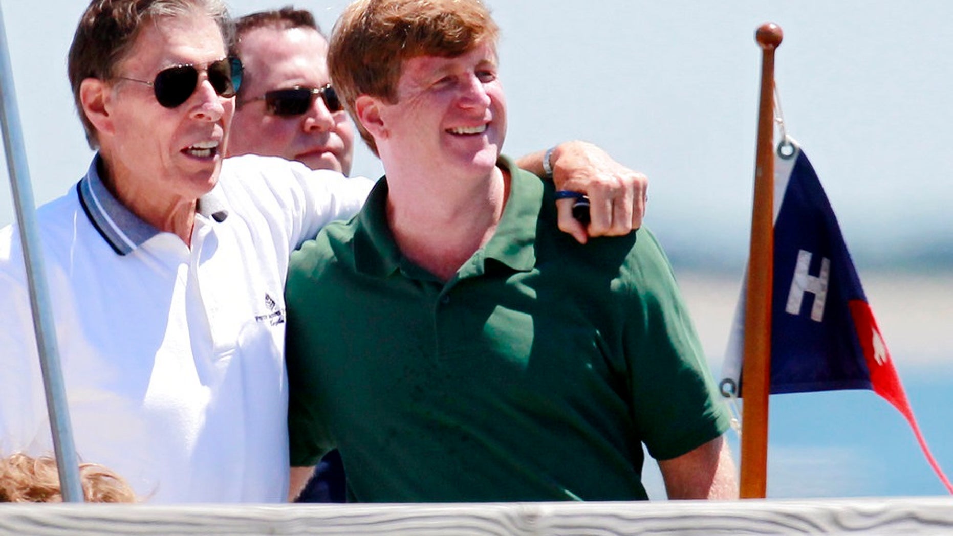 Former U.S. Sen. John Tunney, left, accompanies Patrick Kennedy on a pier in Hyannis Port, Mass., in July 2011. Tunney died at age 83 on Jan. 12, 2018.