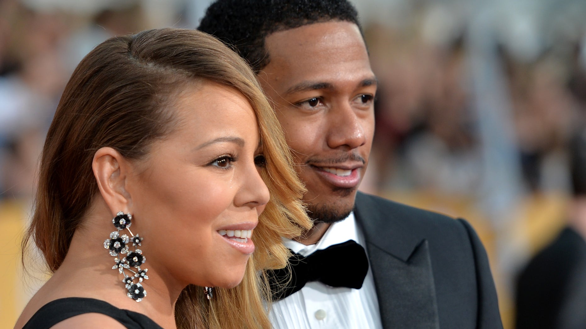LOS ANGELES, CA - JANUARY 18: Singer Mariah Carey (L) and TV personality Nick Cannon attend the 20th Annual Screen Actors Guild Awards at The Shrine Auditorium on January 18, 2014 in Los Angeles, California. (Photo by Alberto E. Rodriguez/Getty Images)