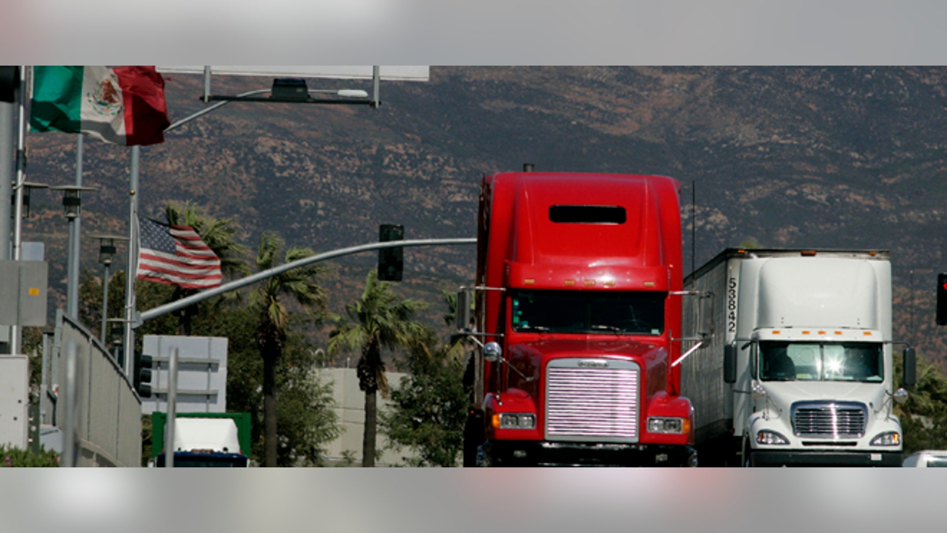OTAY MESA, CA-MARCH 24: Trucks coming from Mexico prepare to enter the highway after crossing the border March 24, 2009 in Otay Mesa, California. Mexico last week slapped higher tariffs on an estimated $2.4 billion worth of goods entering the country from the U.S. in response to a move by Congress to end a pilot program allowing Mexican trucks to operate in the U.S. (Photo by Sandy Huffaker/Getty Images)
