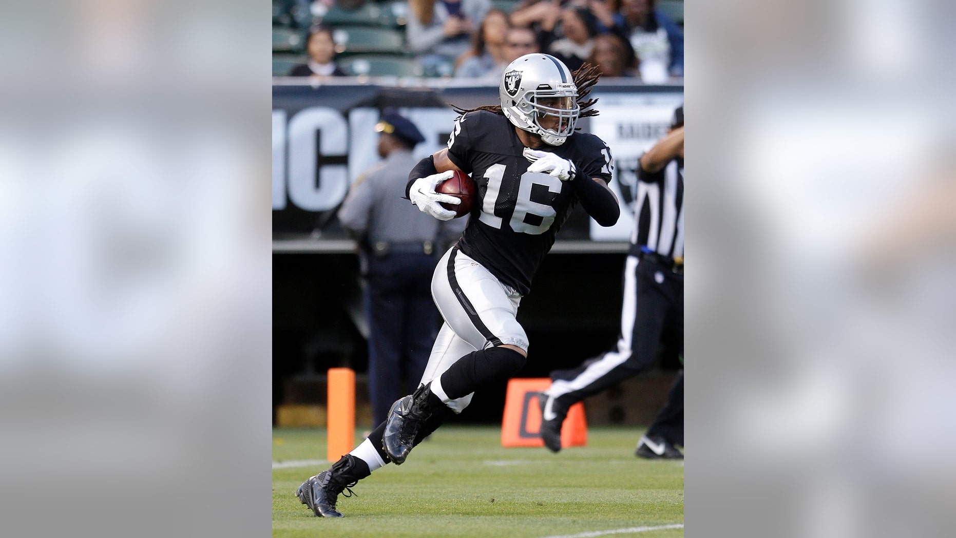 FILE - in this Aug. 23, 2013, file photo, Oakland Raiders' Josh Cribbs returns a kick against the Chicago Bears in the first half of an NFL football game in Oakland, Calif. The New York Jets have signed Cribbs, a three-time Pro Bowl wide receiver-kick returner, to help on special teams and add depth to their banged-up receiving corps. He was cut by Oakland in the preseason after having offseason surgery to repair a torn meniscus in his left knee. (AP Photo/Jeff Chiu, File)