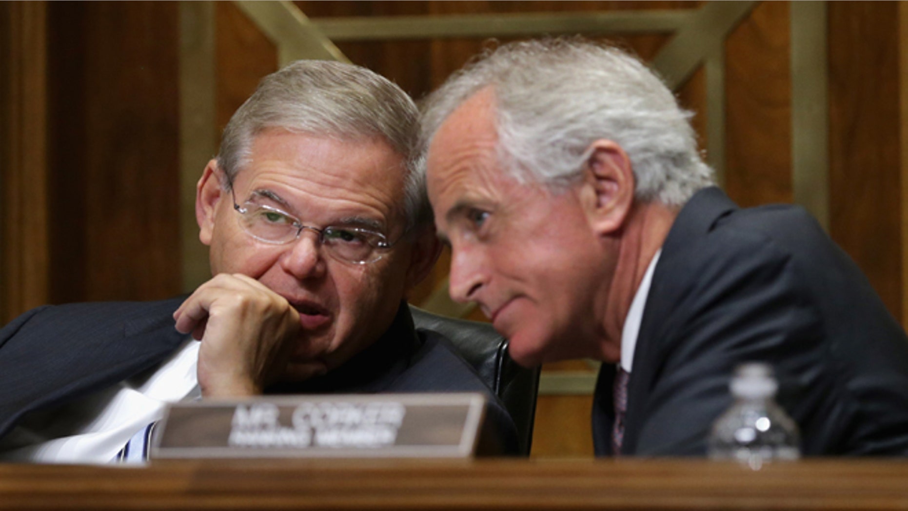 Sen. Robert Menendez, D-N.J., right, and Sen. Bob Corker, R-Tenn. talk on Capitol Hill in Washington. (Photo by Chip Somodevilla/Getty Images)