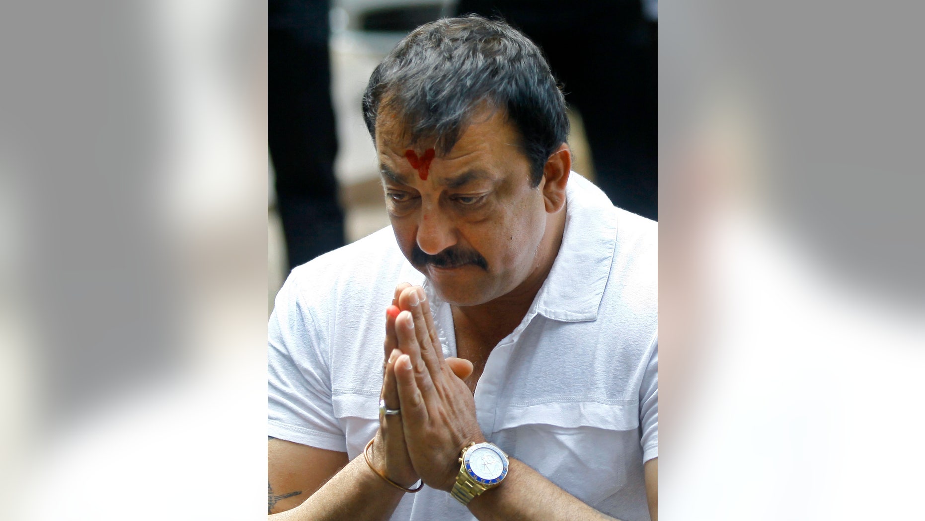 FILE- In this March 28, 2013 file photo, Indian Bollywood actor Sanjay Dutt, gestures during a press conference at his residence in Mumbai, India. Dutt has appealed to India's Supreme Court to give him some more time before he begins a prison sentence for a 1993 weapons conviction linked to a deadly terror attack. Dutt filed his appeal Monday, April 15, 2013 saying he needed time to complete his film commitments. Last month the court sentenced Dutt to five years in prison for illegal possession of weapons supplied by Muslim mafia bosses linked to the terror attack that killed 257 people in Mumbai.(AP Photo/Rafiq Maqbool, File)