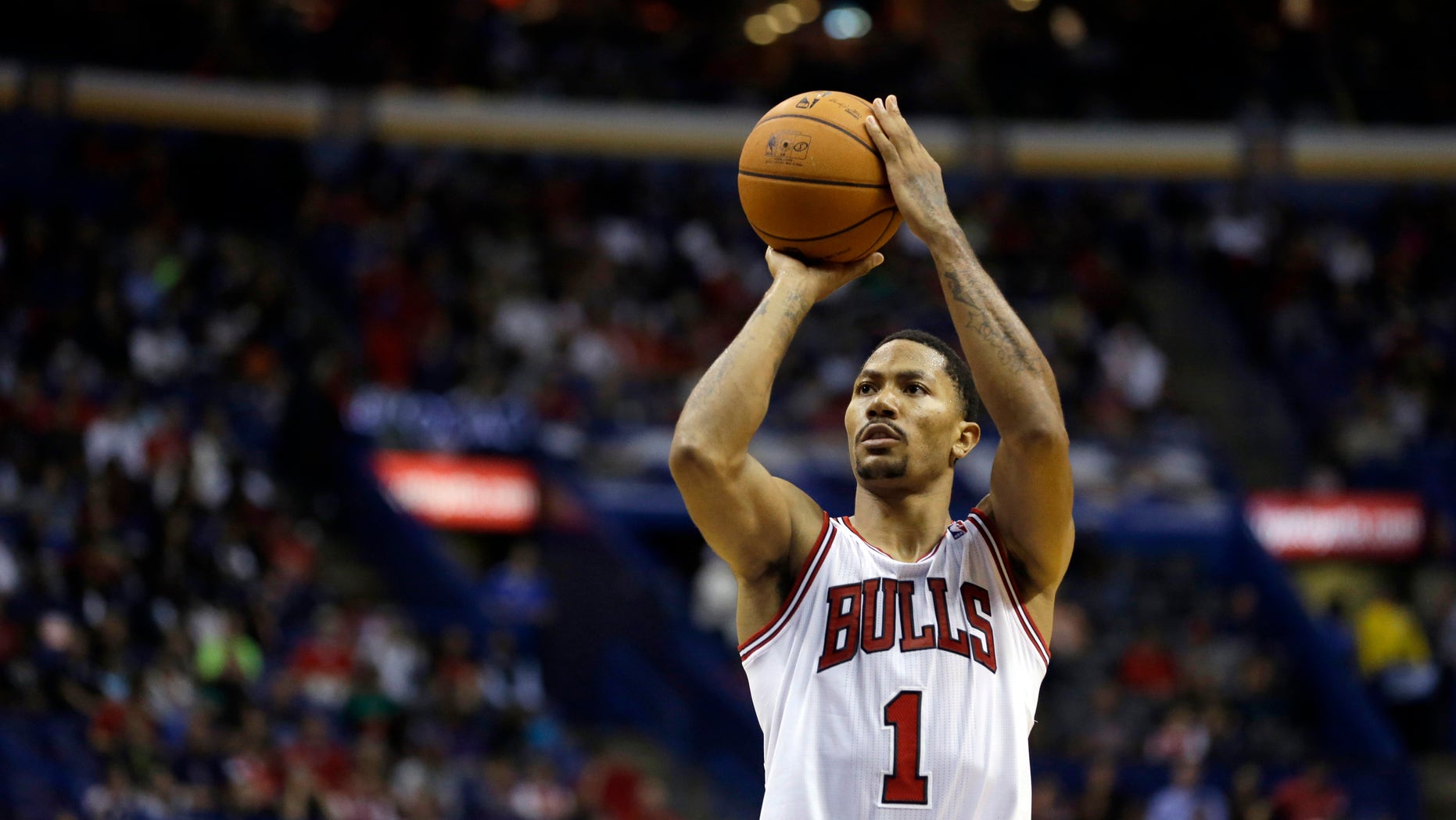 ADVANCE FOR WEEKEND EDITIONS, OCT. 26-27- FILE - In this Oct. 7, 2013, file photo, Chicago Bulls' Derrick Rose shoots a free throw during an NBA preseason basketball game against the Memphis Grizzlies in St. Louis. The Bulls have their point guard back, and they believe they're ready to challenge LeBron James and the Miami Heat for supremacy in the Eastern Conference, starting with their season-opening matchup on Oct. 29. (AP Photo/Jeff Roberson, File)