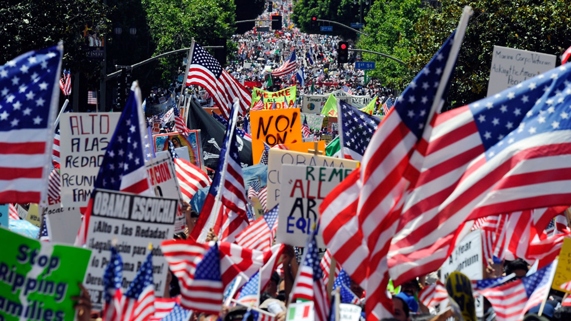 LOS ANGELES, CA - MAY 01: Thousands of demonstrators march during a May Day immigration rally on May 1, 2010 in Los Angeles, California. More than 100,000 people were expected to march from four directions towards Los Angeles City Hall to protest Arizona's new immigration law. (Photo by Kevork Djansezian/Getty Images)