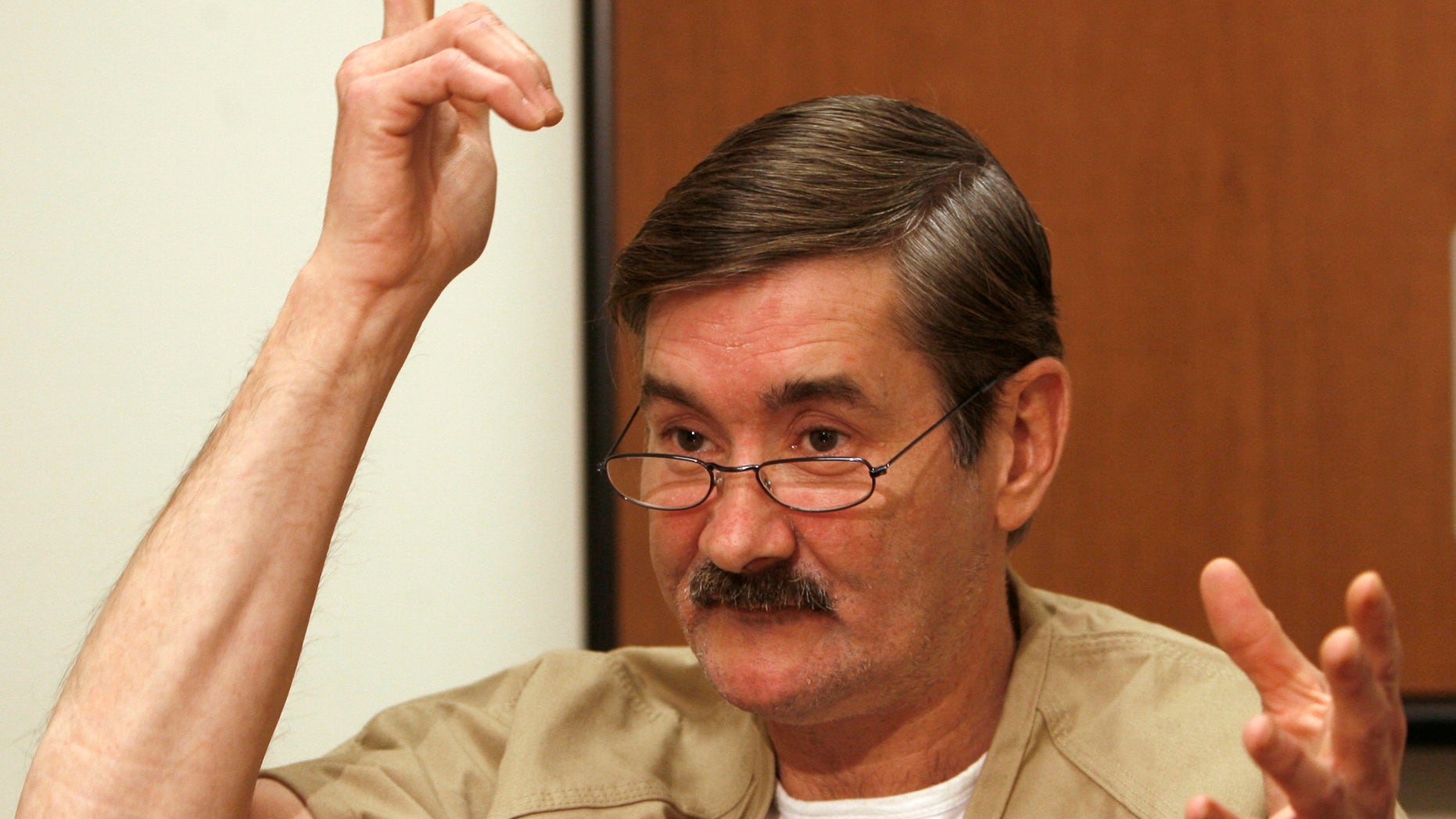 FILE - In this Dec. 4, 2007 file photo, Leeland Eisenberg talks about strapping a fake bomb to himself and taking people hostage at the Rochester, N.H. presidential campaign office of Hillary Rodham Clinton, during an interview from the Strafford County Jail in Dover, N.H. Eisenberg, who took hostages at a Hillary Rodham Clinton presidential campaign office in 2007, escaped from a minimum-security correctional facility on Sunday, April 7, 2013 authorities said. (AP Photo/Jim Cole, File)