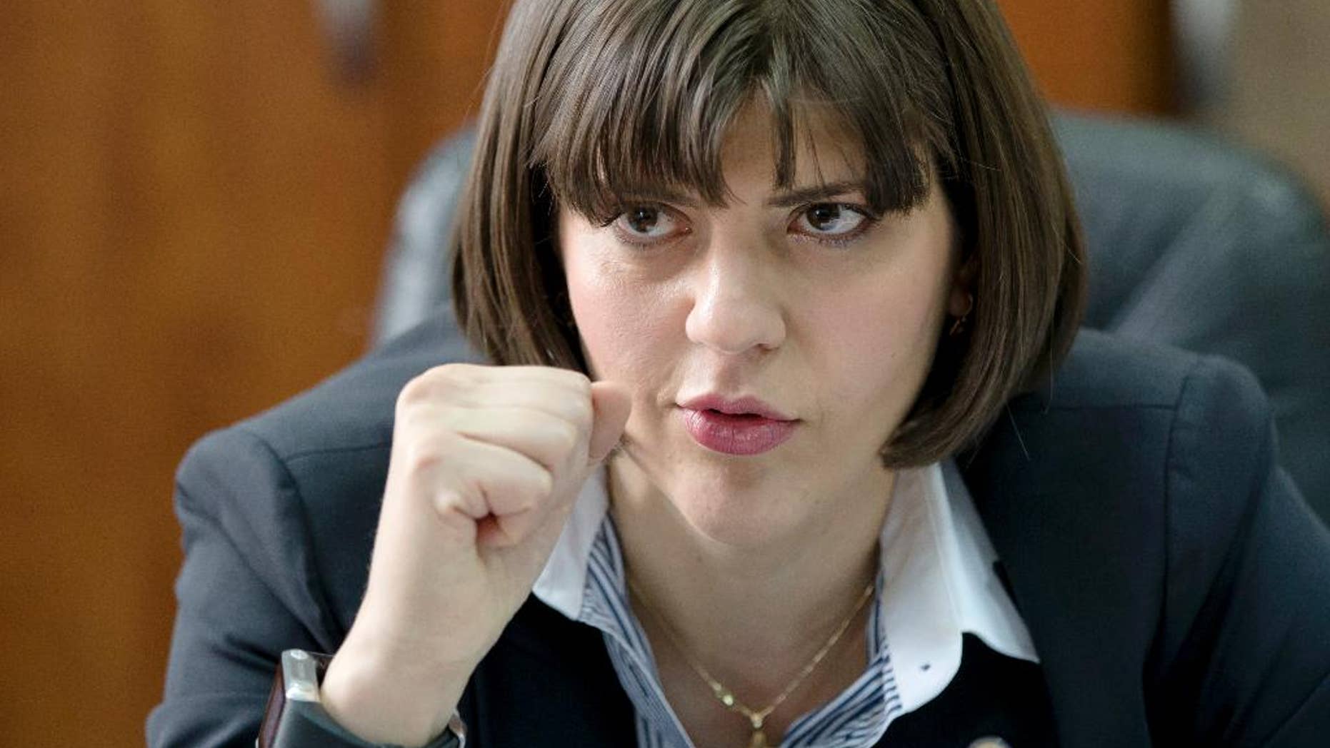 FILE- In this file picture taken on Wednesday, April 8, 2015 Laura Codruta Kovesi the chief prosecutor of Romania's anti-corruption authority, the DNA, speaks during an interview with the Associated Press in Bucharest, Romania. Romania’s organized crime prosecutors’ office said Wednesday, April 6, 2016, two Israeli citizens, Ron Weiner and David Geclowicz, employees of private Israeli intelligence agency Black Cube, have been arrested on suspicion of setting up a criminal group to harass and intimidate Kovesi and people close to her. (AP Photo/Vadim Ghirda, File)