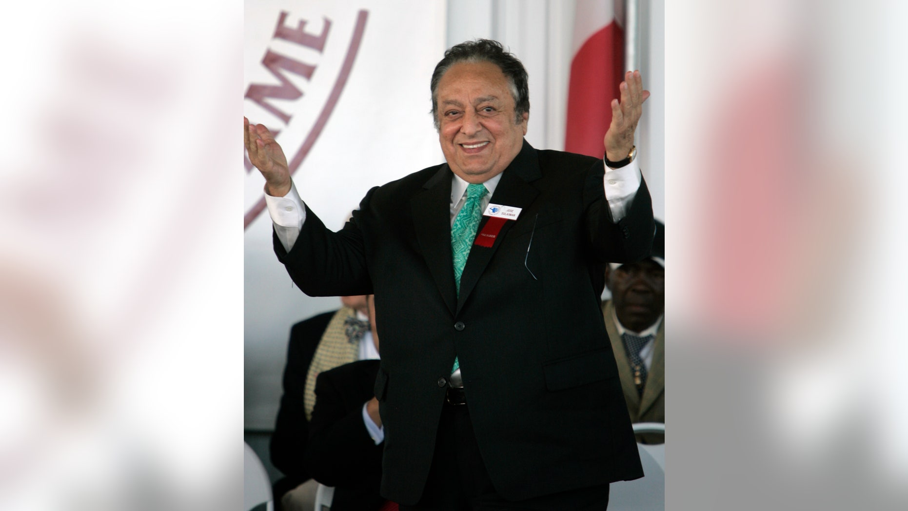 FILE - In this June, 10, 2007 file photo Jose Sulaiman, president of the World Boxing Council, acknowledges the crowd as he is inducted into the International Boxing Hall of Fame in Canastota, N.Y., Sunday, June 10, 2007. Sulaiman's son, Mauricio Sulaiman, said his father died Thursday Jan. 16, 2014, at a hospital in Los Angeles. He had been hospitalized for months for a heart condition. (AP Photo/Mike Groll, File)