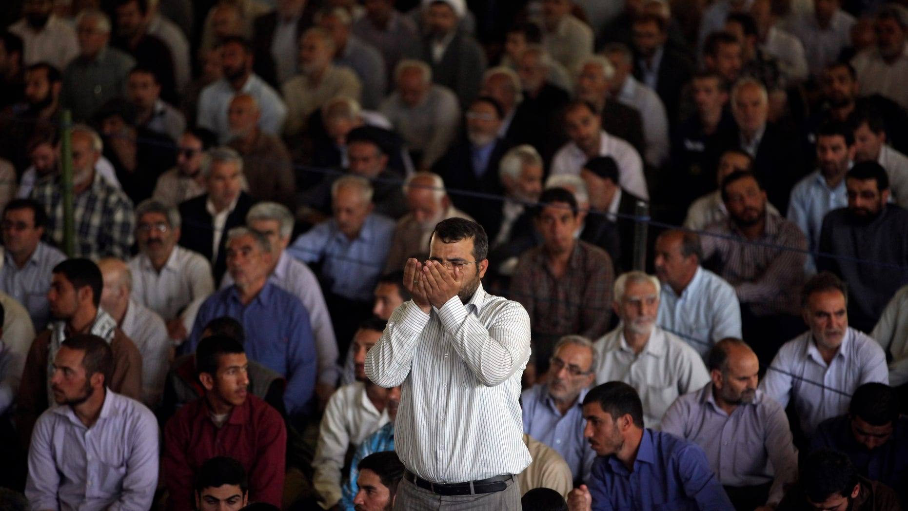 An Iranian worshipper prays at the start of Friday prayers at Tehran University in Tehran, Iran, Friday, May 17, 2013. (AP Photo/Vahid Salemi)