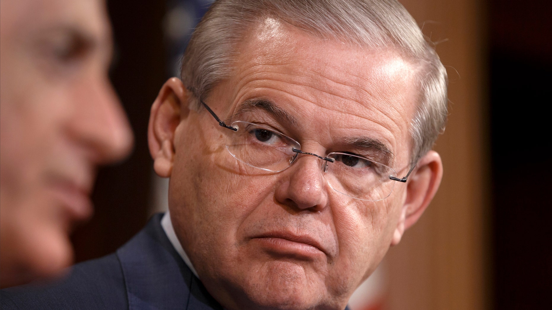 FILE - This March 27, 2014 file photo shows Sen. Robert Menendez, D-N.J. on Capitol Hill in Washington. Menendez says his attorney has asked the Justice Department to investigate whether the Cuban government had a role in allegations against him that have prompted a federal probe of the New Jersey Democrat. (AP Photo/J. Scott Applewhite, File)