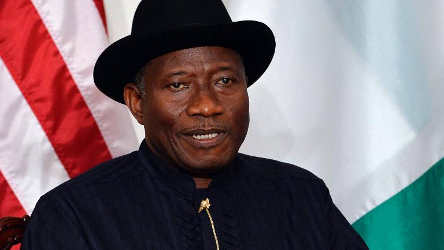 President Goodluck Jonathan of Nigeria listens as the US President speaks before a bilateral meeting in New York on September 23, 2013