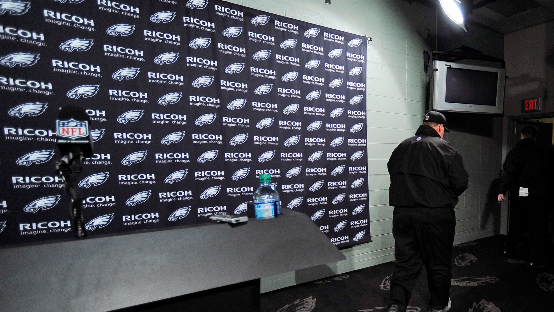Philadelphia Eagles coach Andy Reid leaves after a news conference following an NFL football game against the Washington Redskins, Sunday, Dec. 23, 2012, in Philadelphia. Washington won 27-20. (AP Photo/Michael Perez)