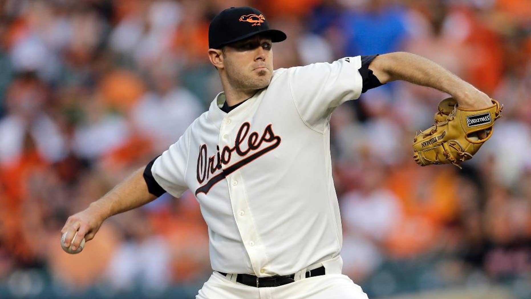 Baltimore Orioles starting pitcher Chris Tillman throws to the St. Louis Cardinals in the first inning of an interleague baseball game, Friday, Aug. 8, 2014, in Baltimore. (AP Photo/Patrick Semansky)