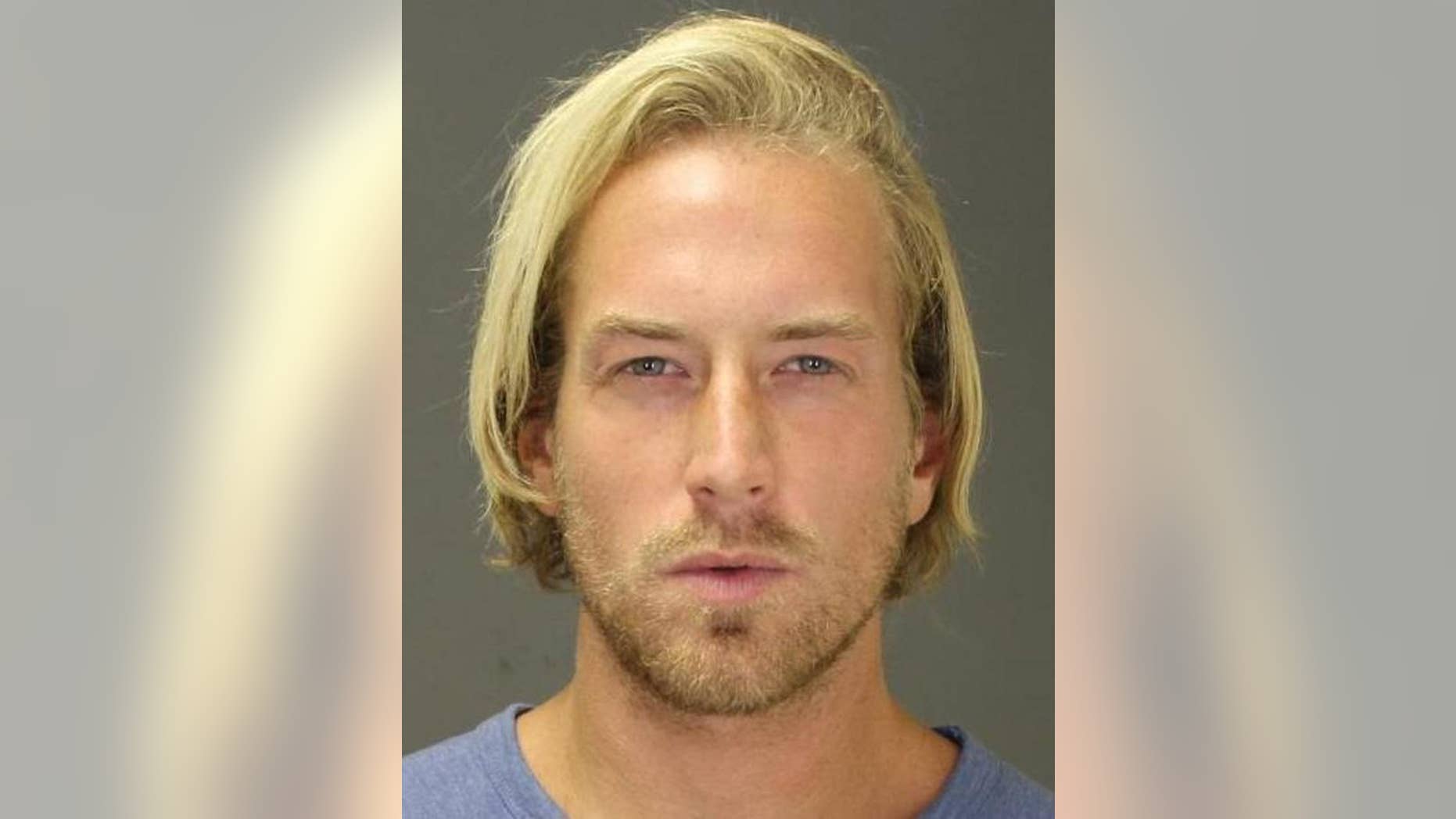 FILE - This Sept. 2014 file photo provided by the Suffolk County District Attorney’s office shows Thomas Gilbert Jr., after an arrest in the town of Southampton, N.Y., on a misdemeanor charge. Gilbert's hedge-fund founder father, Thomas Gilbert Sr., was found dead on Jan. 4, 2015, and his son was arrested and accused of murder. On Thursday, Feb. 5, 2015 Gilbert appeared in court in New York and pleaded not guilty to the charges. (AP Photo/Suffolk County District Attorney’s office, File)
