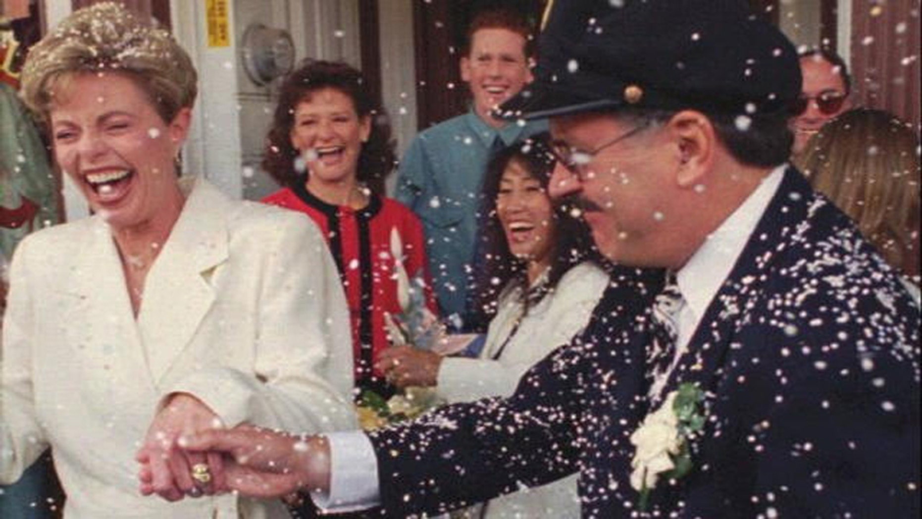 Toni Tennille (L) and Daryl Dragon singing duo "The Captain and Tennille", after renewing wedding vows in 1995.