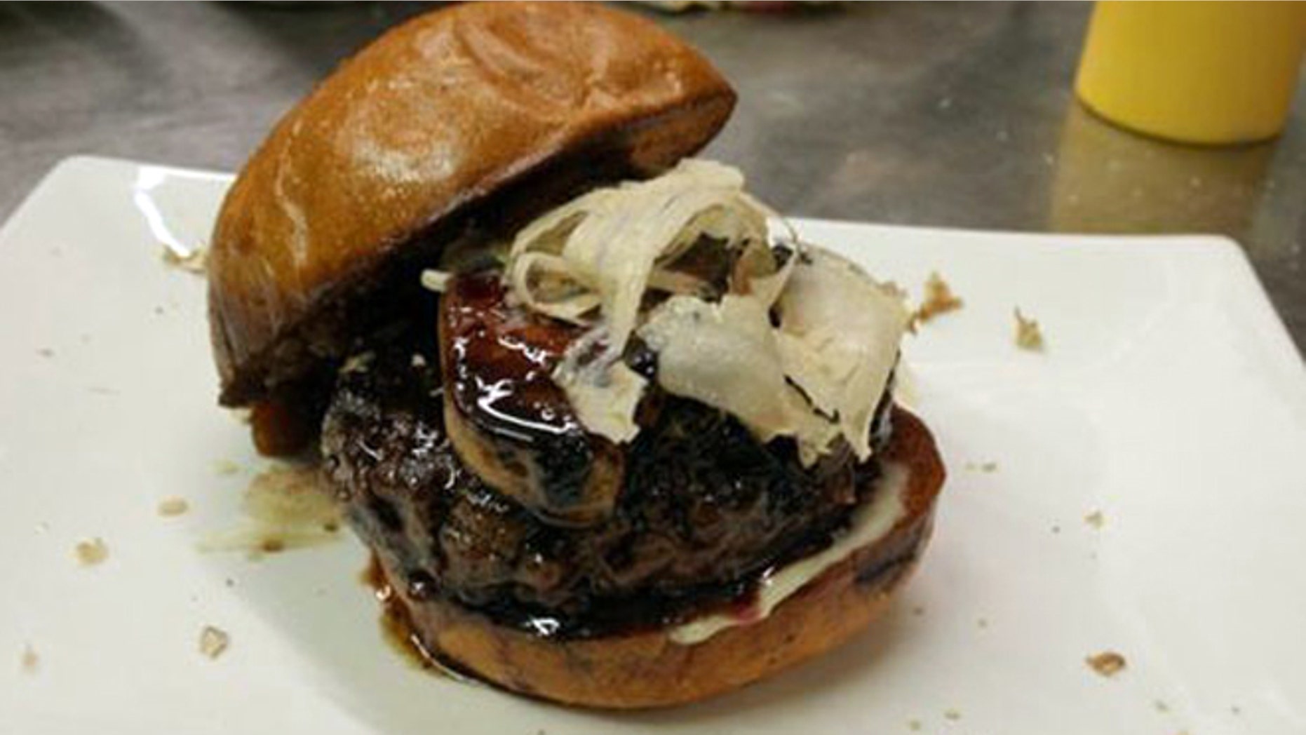The MNO Burger is topped with truffles, foie gras and port.