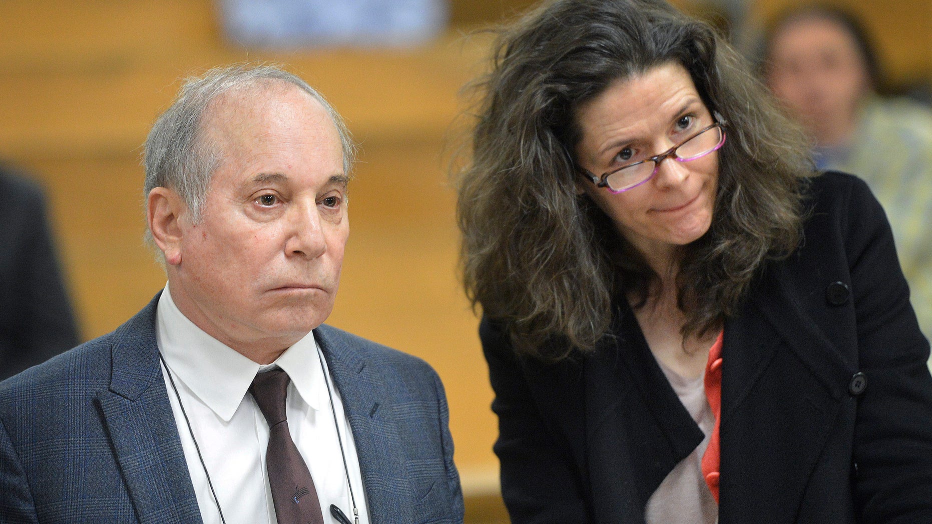 Singer Paul Simon, left, and his wife Edie Brickell appear at a hearing in Norwalk Superior Court on Monday April 28, 2014 in Norwalk, Conn. The couple were arrested Saturday on disorderly conduct charges by officers investigating a family dispute at their home in New Canaan, Conn. (AP Photo/The Hour, Alex von Kleydorff, Pool)