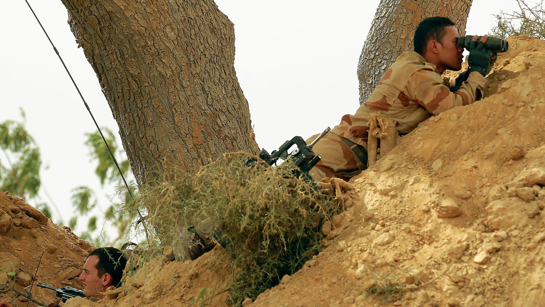 Jan. 22, 2013: French foreign legionnaires take position outside Marakala, central Mali, some 240kms from Bamako. French troops in armored personnel carriers rolled through the streets of Diabaly on Monday, winning praise from residents of this besieged town after Malian forces retook control of it with French help a week after radical Islamists invaded.