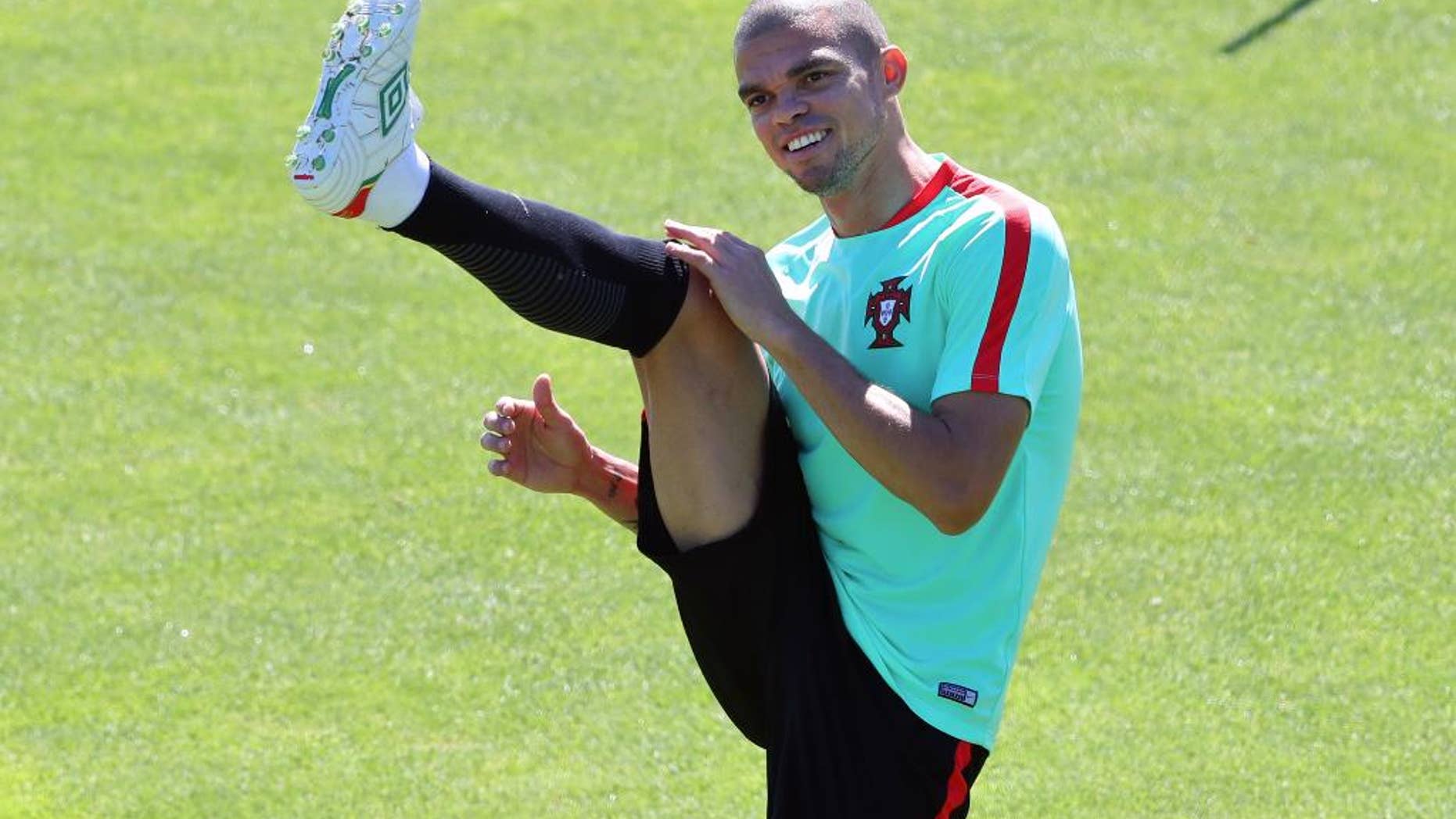Portugal's Pepe stretches during a training session in Marcoussis, near Paris, France, Saturday, July 9, 2016. Portugal will face France in a Euro 2016 final soccer match in Saint Denis on Sunday, July 10, 2016. (AP Photo/Thibault Camus)