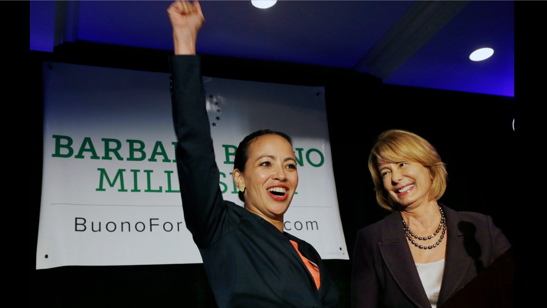 Labor leader Milly Silva reacts Monday, July 29, 2013, in East Rutherford, N.J., as she is introduced as Democratic gubernatorial candidate Barbara Buono's, right, nominee for lieutenant governor. The 43-year-old Montclair resident and executive vice president of a private union of health care workers, wasted no time attacking Republican Gov. Chris Christie, whose policies she says have hurt the middle- and working-class. The all-female ticket is a first for New Jersey and only the third nationwide. (AP Photo/Mel Evans)