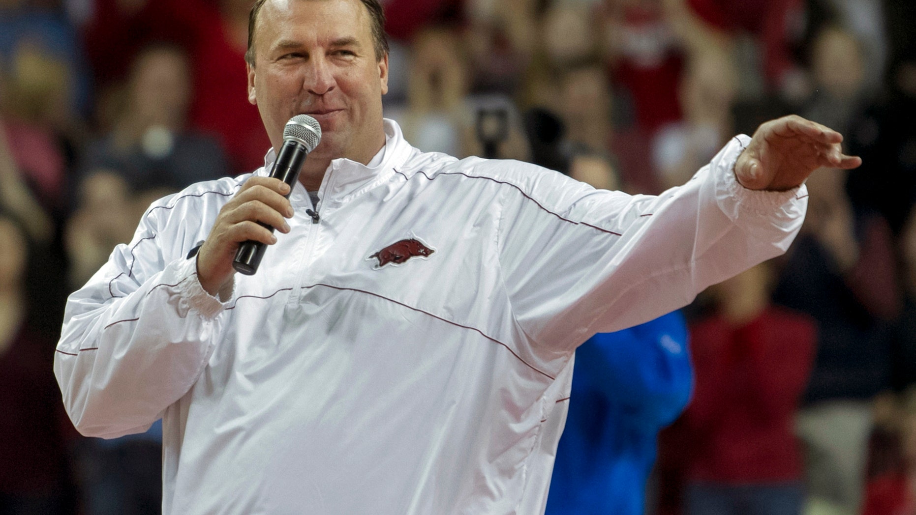 Arkansas head football coach Bret Bielema speaks during a time out in the first half an NCAA college basketball game against Tennessee in Fayetteville, Ark., Saturday, Feb. 2, 2013. Arkansas defeated Tennessee 73-60. (AP Photo/Gareth Patterson)
