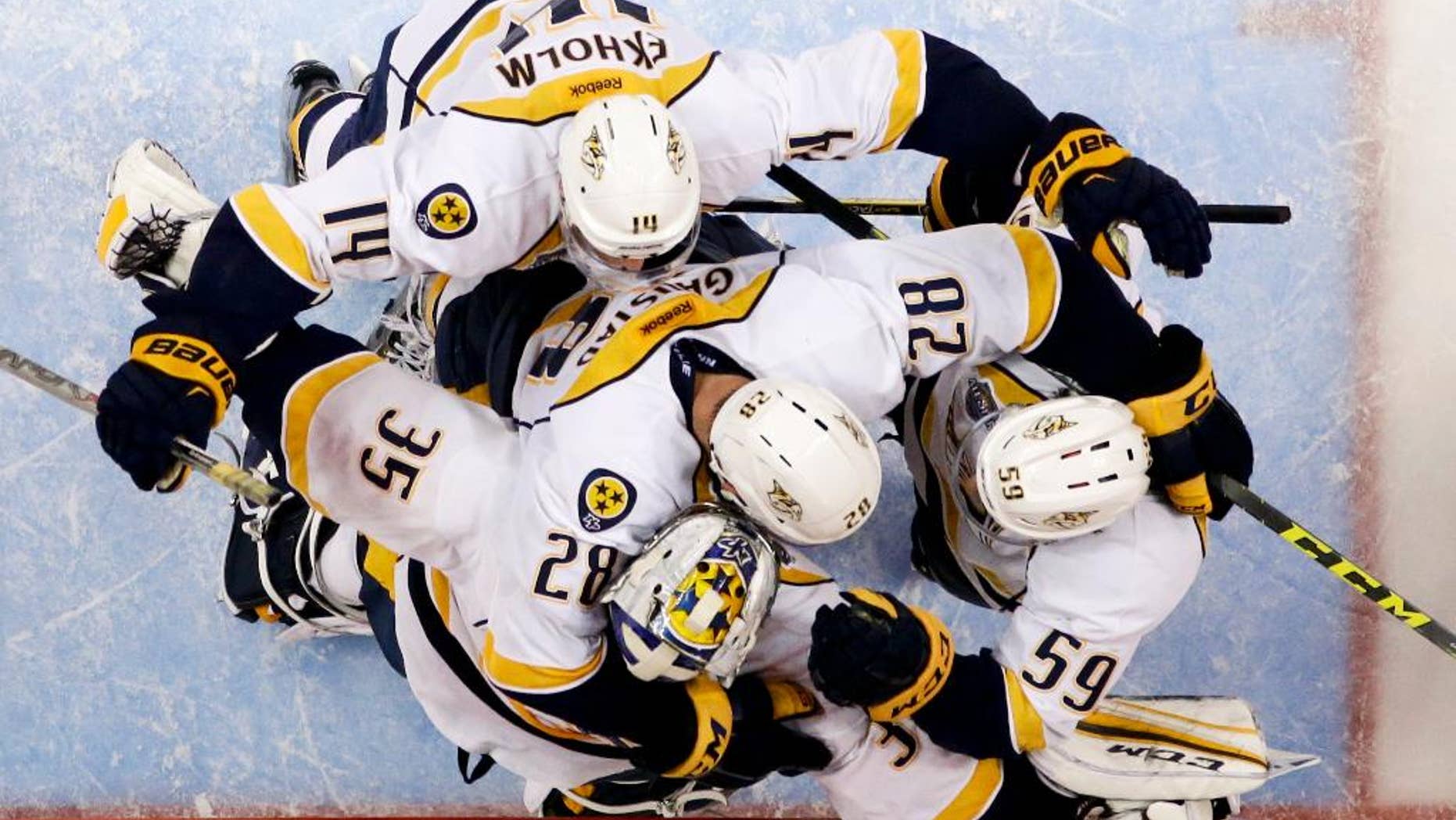 Nashville Predators celebrates a 2-1 win over the Anaheim Ducks during Game 7 in an NHL hockey Stanley Cup playoffs first-round series in Anaheim, Calif., Wednesday, April 27, 2016. (AP Photo/Chris Carlson)