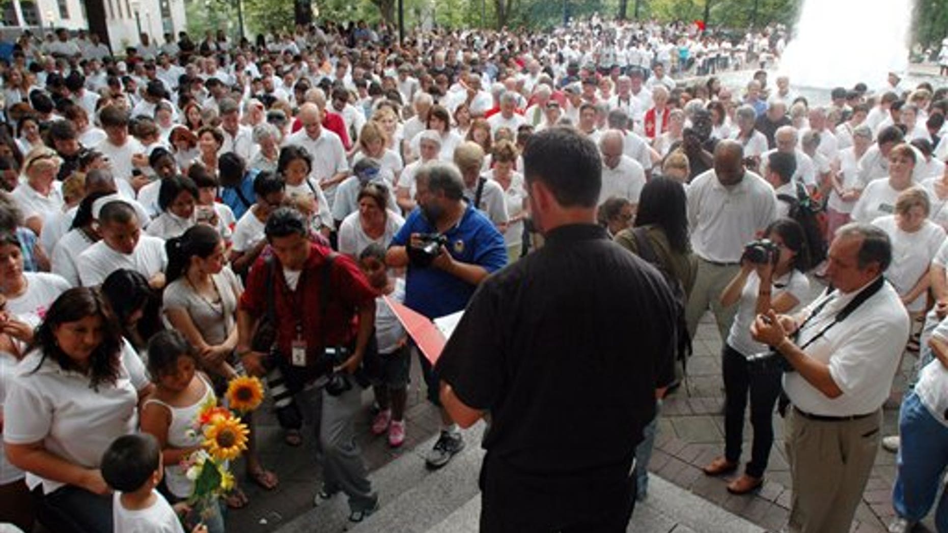 Demonstrators in Alabama bow their heads in prayer during a June demonstration to protest the new state law against illegal immigration. The law is said to be the strictest state-level immigration law in the country.