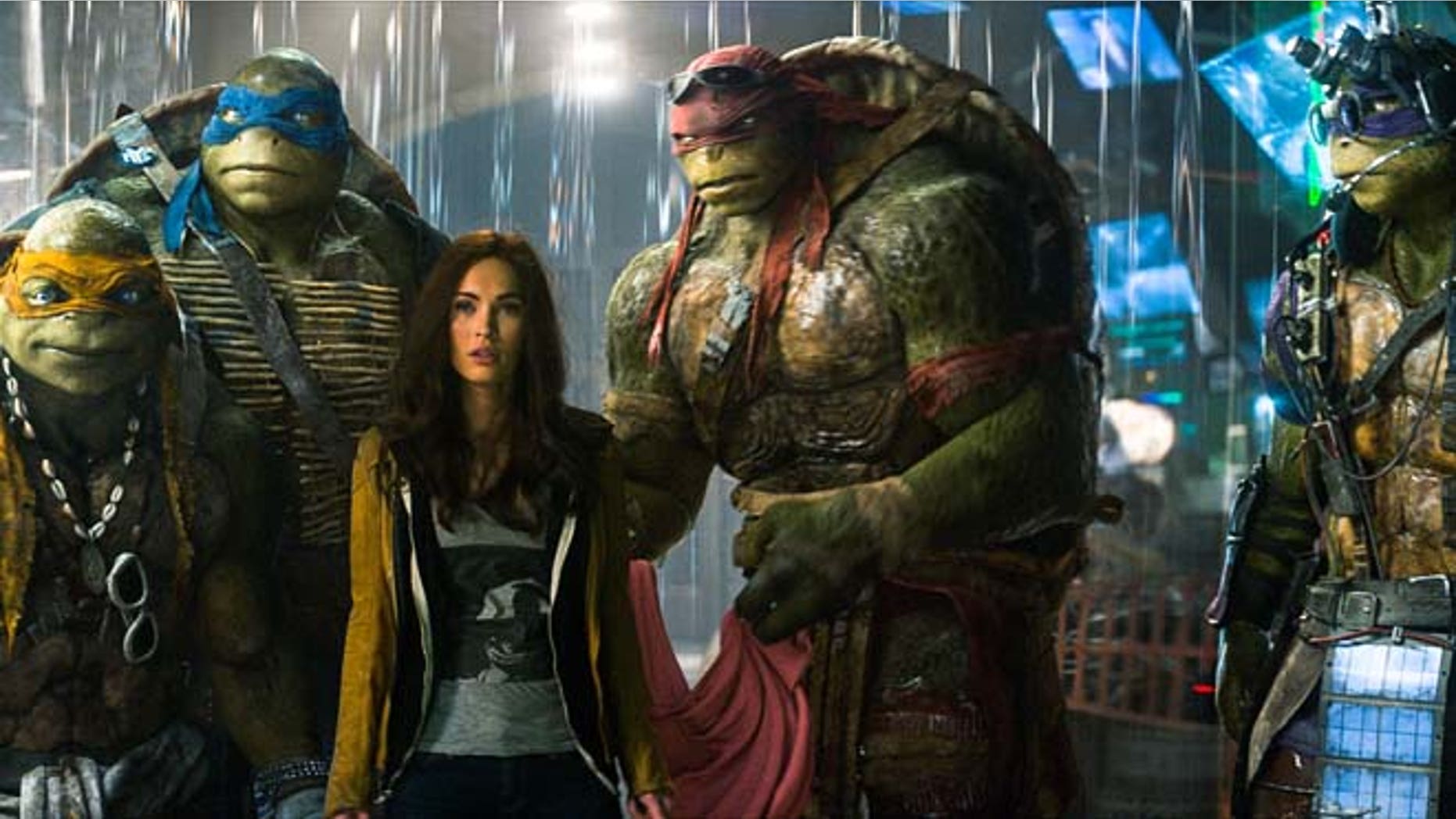 This image shows, from left, Michelangelo, Leonardo, Megan Fox, as April O'Neil, Raphael, and Donatello in a scene from "Teenage Mutant Ninja Turtles." (AP/Paramount Pictures, Industrial Light & Magic)