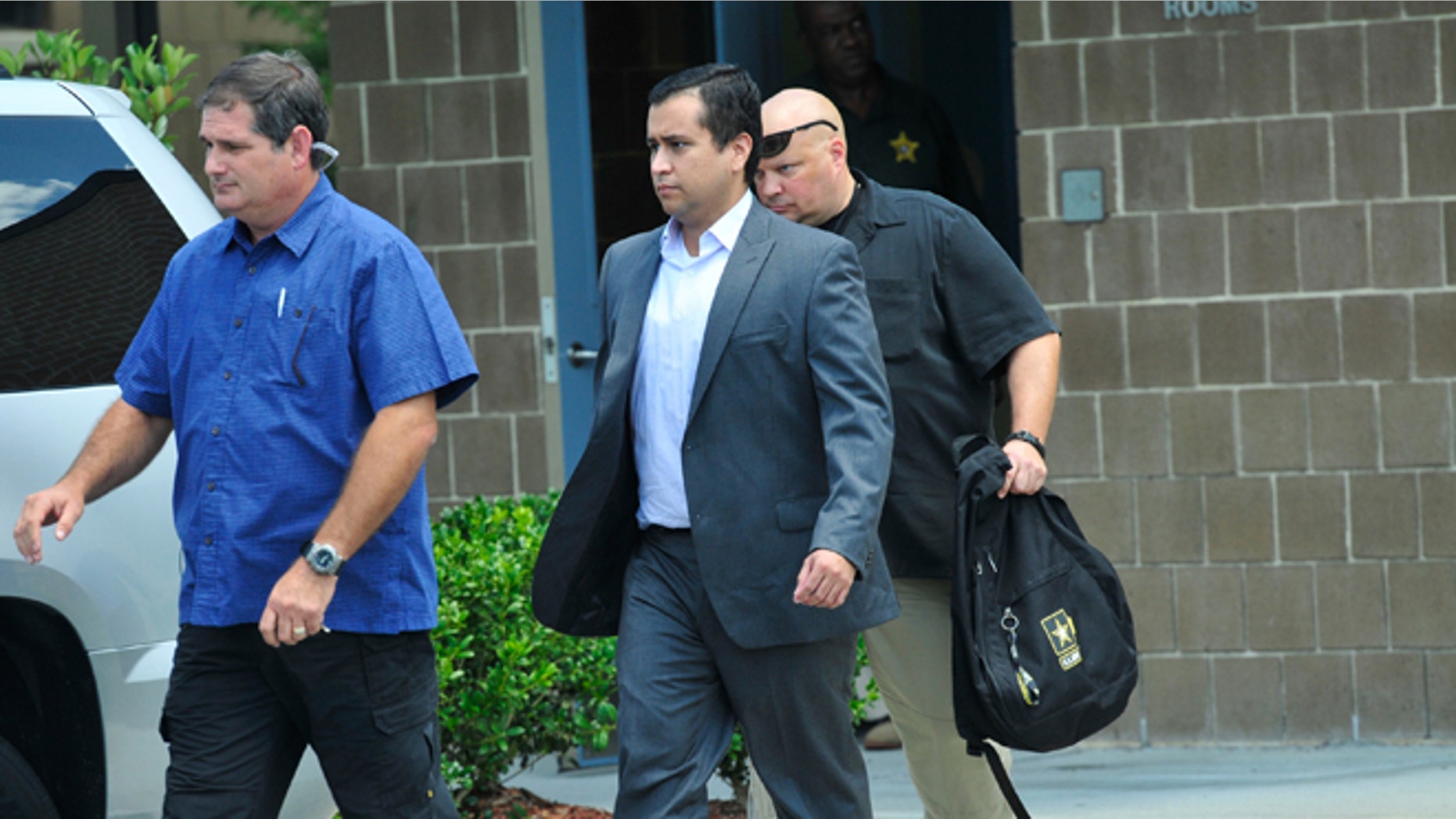 SANFORD, FL- JULY 6: George Zimmerman (C) leaves Seminole County Jail after posting a million dollar bond July 6, 2012 in Sanford, Florida. Zimmerman was charged with second degree murder in the shooting death of Trayvon Martin. (Photo by Roberto Gonzalez/Getty Images)