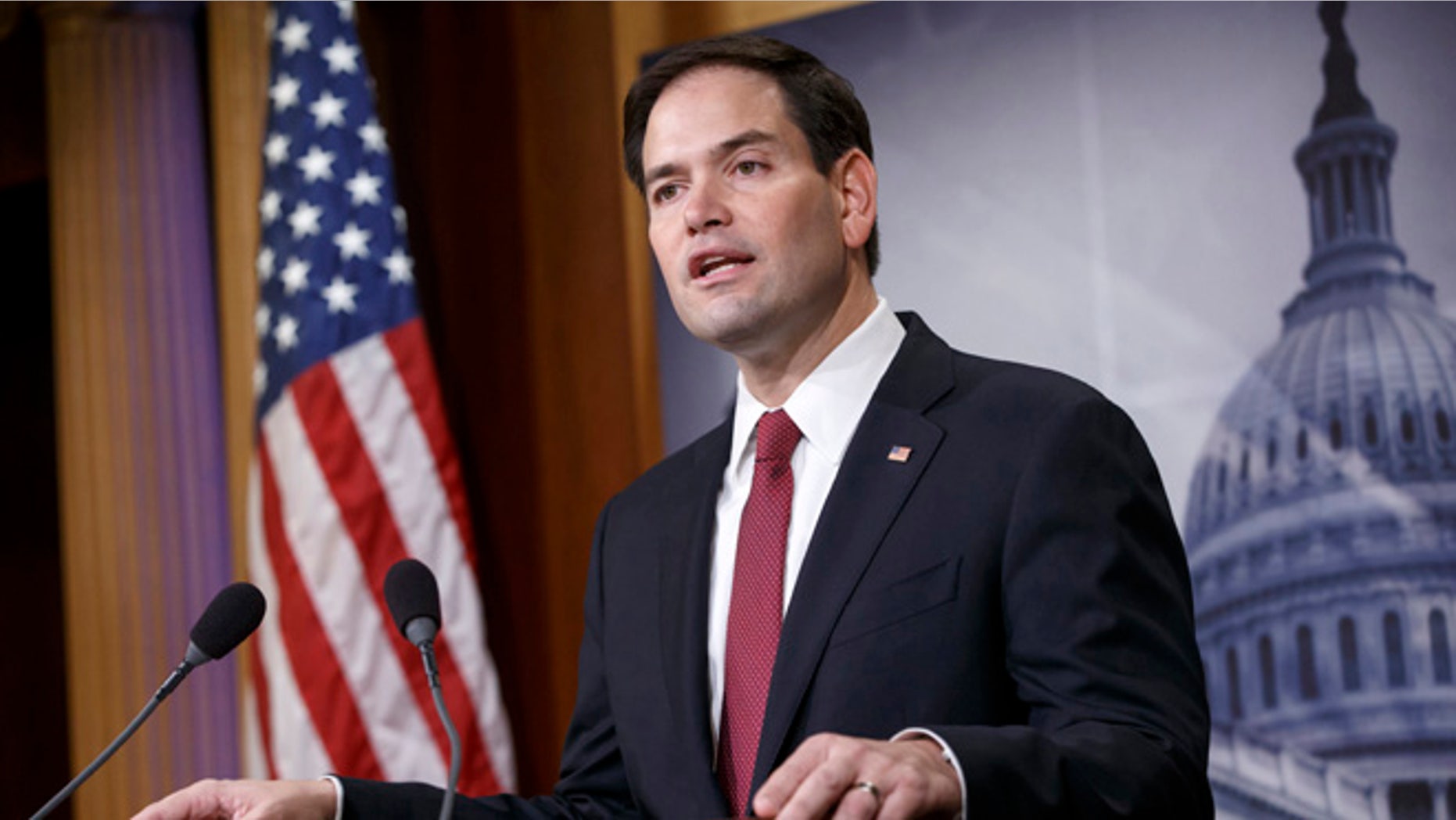 FILE - In this Dec. 17, 2014 file photo, Sen. Marco Rubio, R-Fla. speaks on Capitol Hill in Washington. Rubio seems to be moving toward a bid for the Republicans' presidential nomination, and late Sunday he joins Sens. Ted Cruz of Texas and Rand Paul of Kentucky for an audience with the conservative billionaire Koch brothers. (AP Photo/J. Scott Applewhite, File)