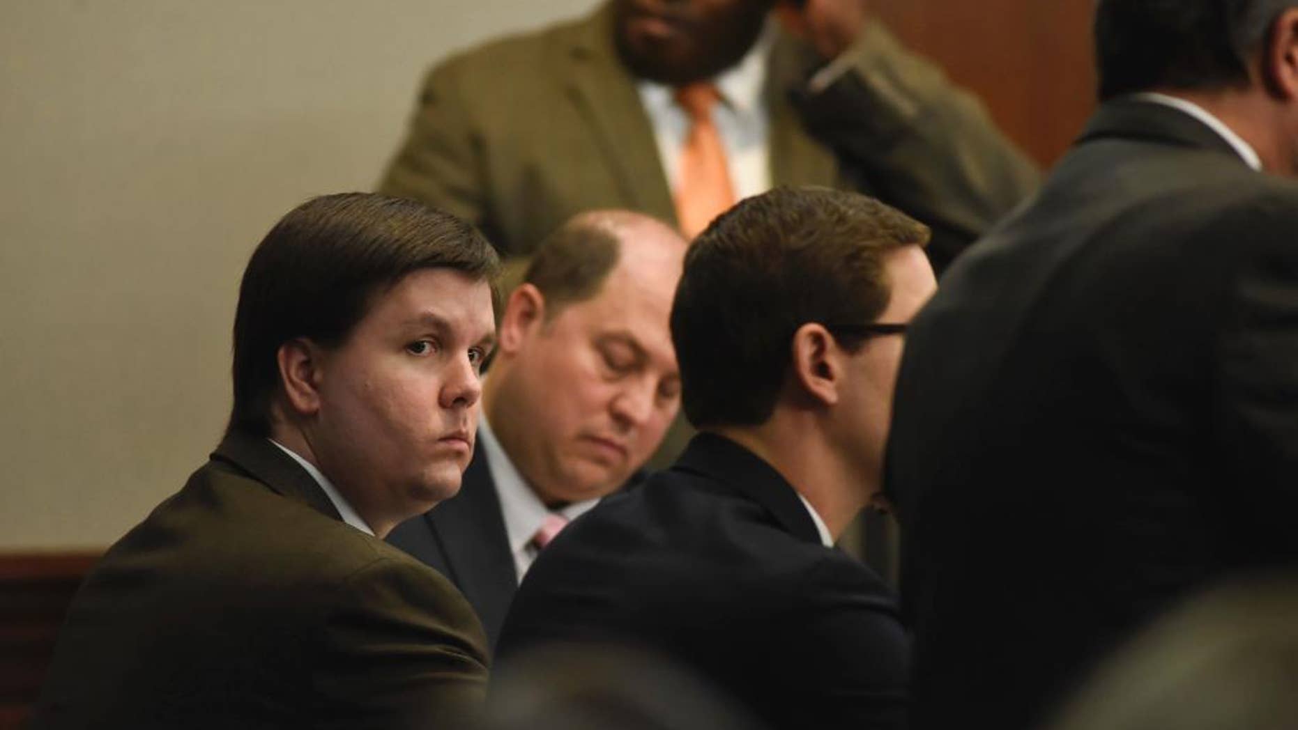 FILE - In this Nov. 14, 2016 file photo, Justin Ross Harris sits with his defense team in the Glynn County Courthouse in Brunswick, Ga. Harris, whose toddler son died after being left for hours in a hot car, was convicted of murder by a jury that concluded a month's worth of trial testimony and evidence showed the father left his child to perish on purpose. (John Carrington/Atlanta Journal-Constitution via AP)