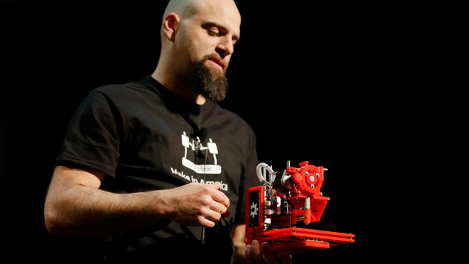 In this photo taken Wednesday, May 15, 2013 Brook Drum, the founder and CEO of Printrbot, displays and talks about his $299 portable 3D printer during the Hardware Innovation Workshop in San Mateo, Calif.